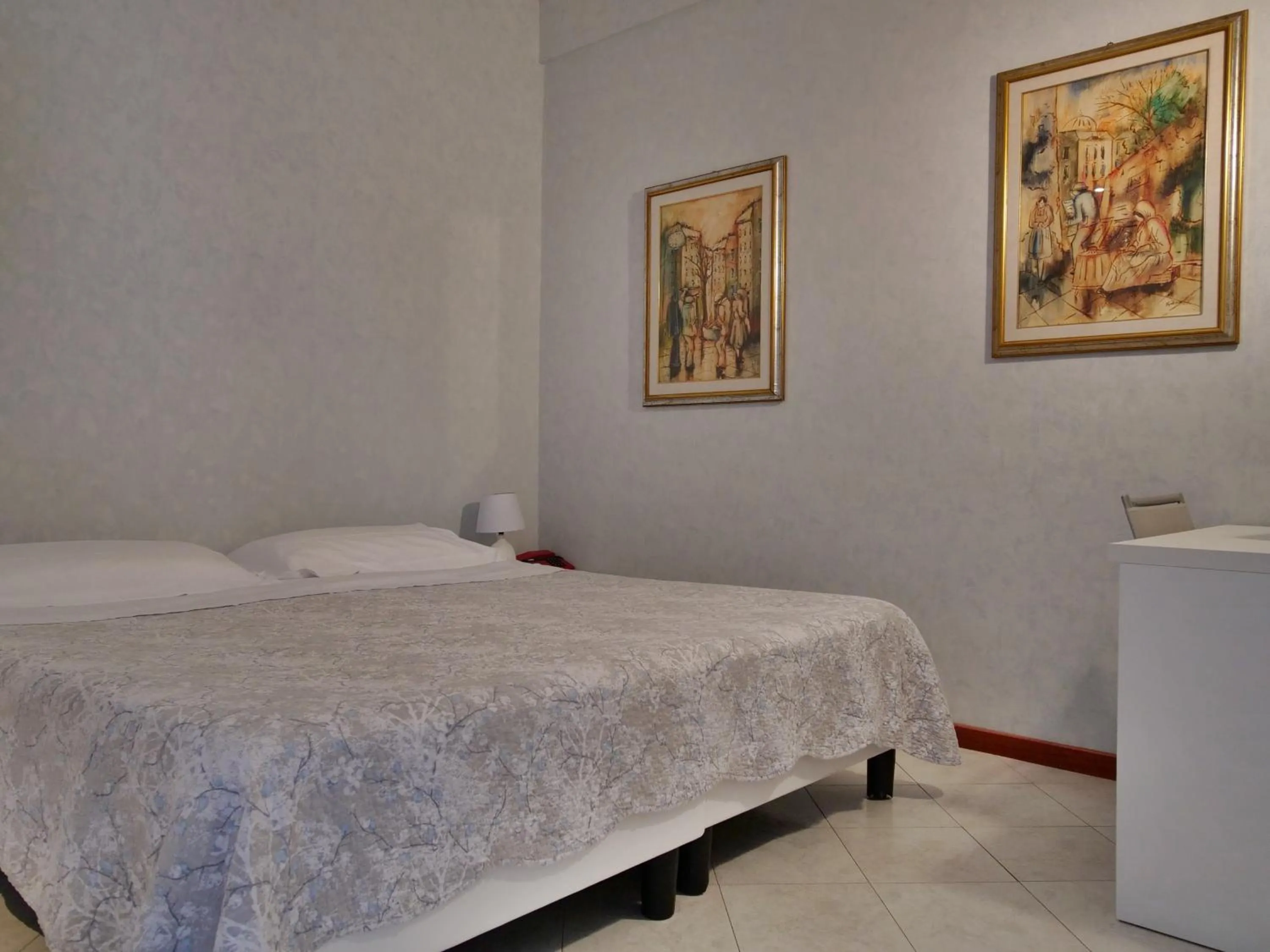 Bed in Hotel Residence Mondial