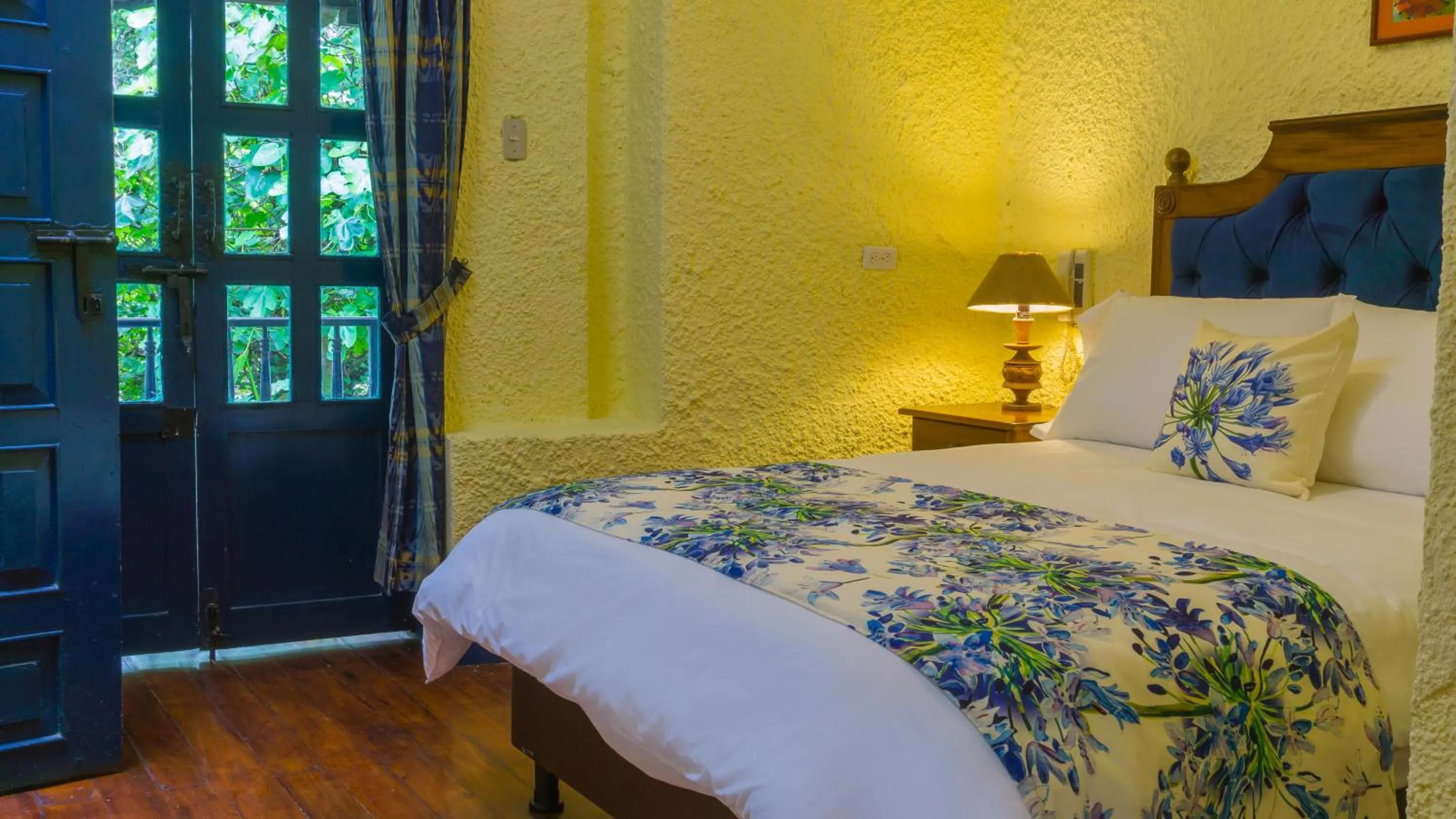 Bed in Hostería Hacienda Pinsaqui