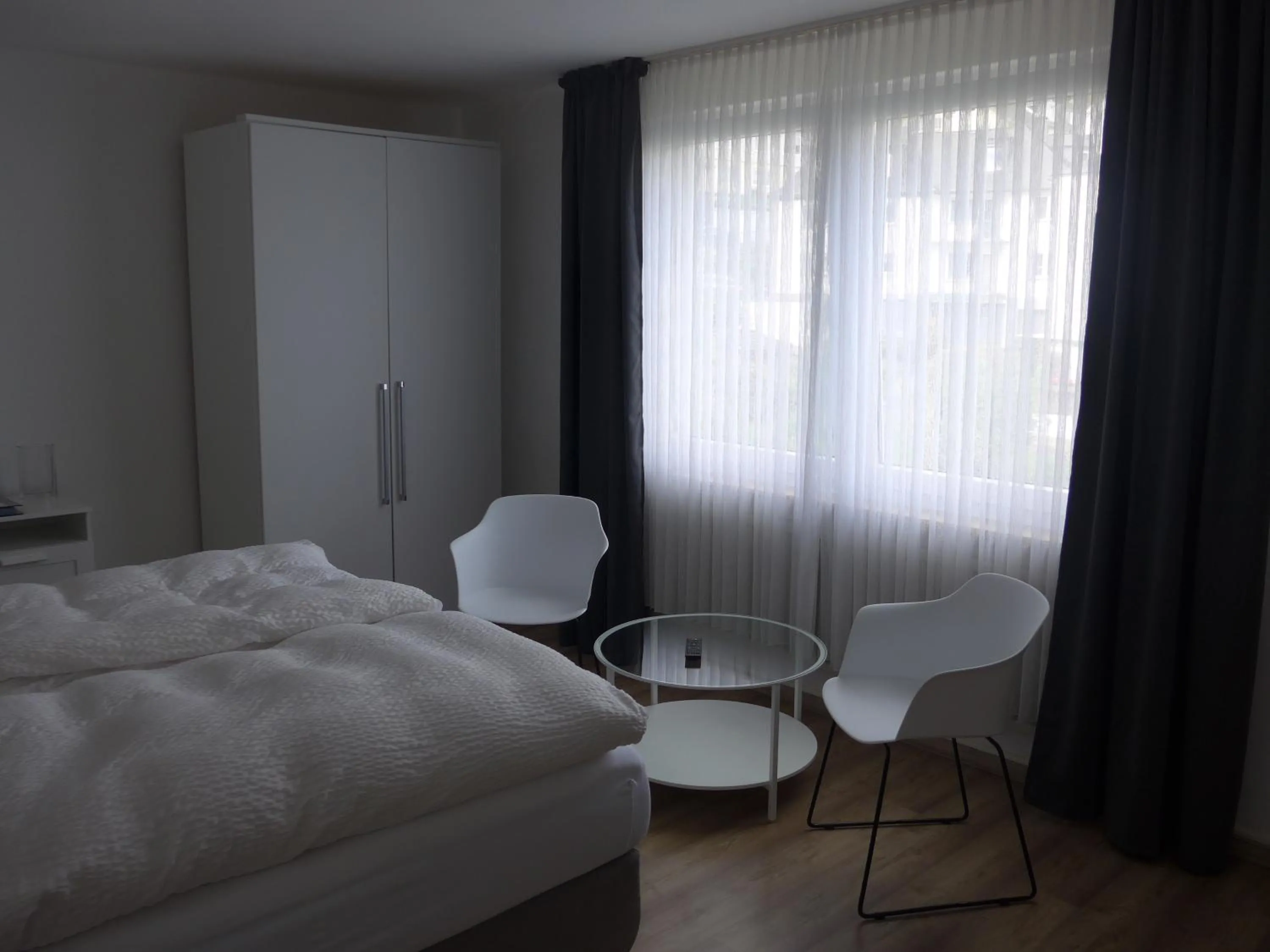 Seating area, Bed in Pension Schneider