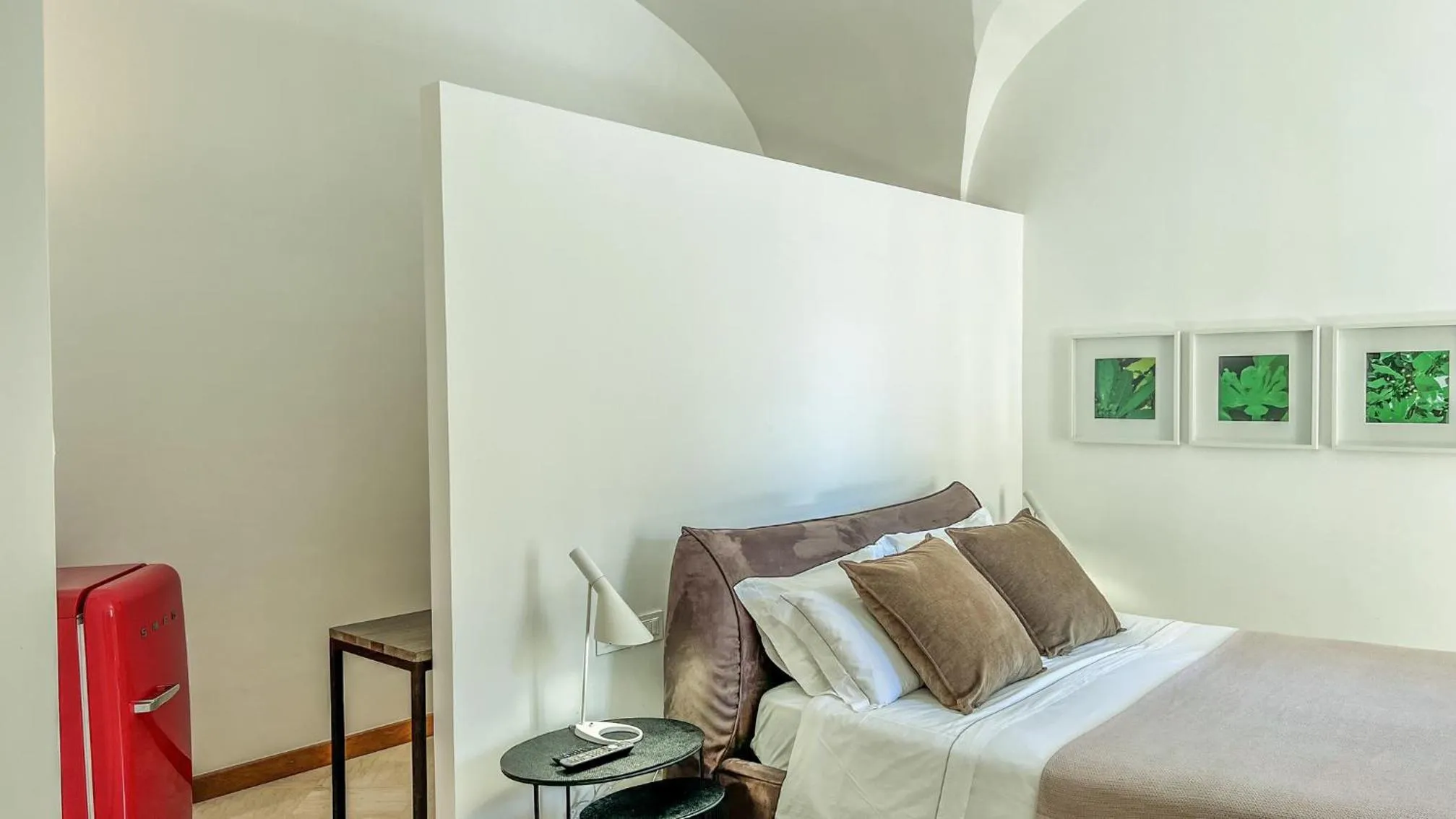Bed in Santacroce Luxury Rooms