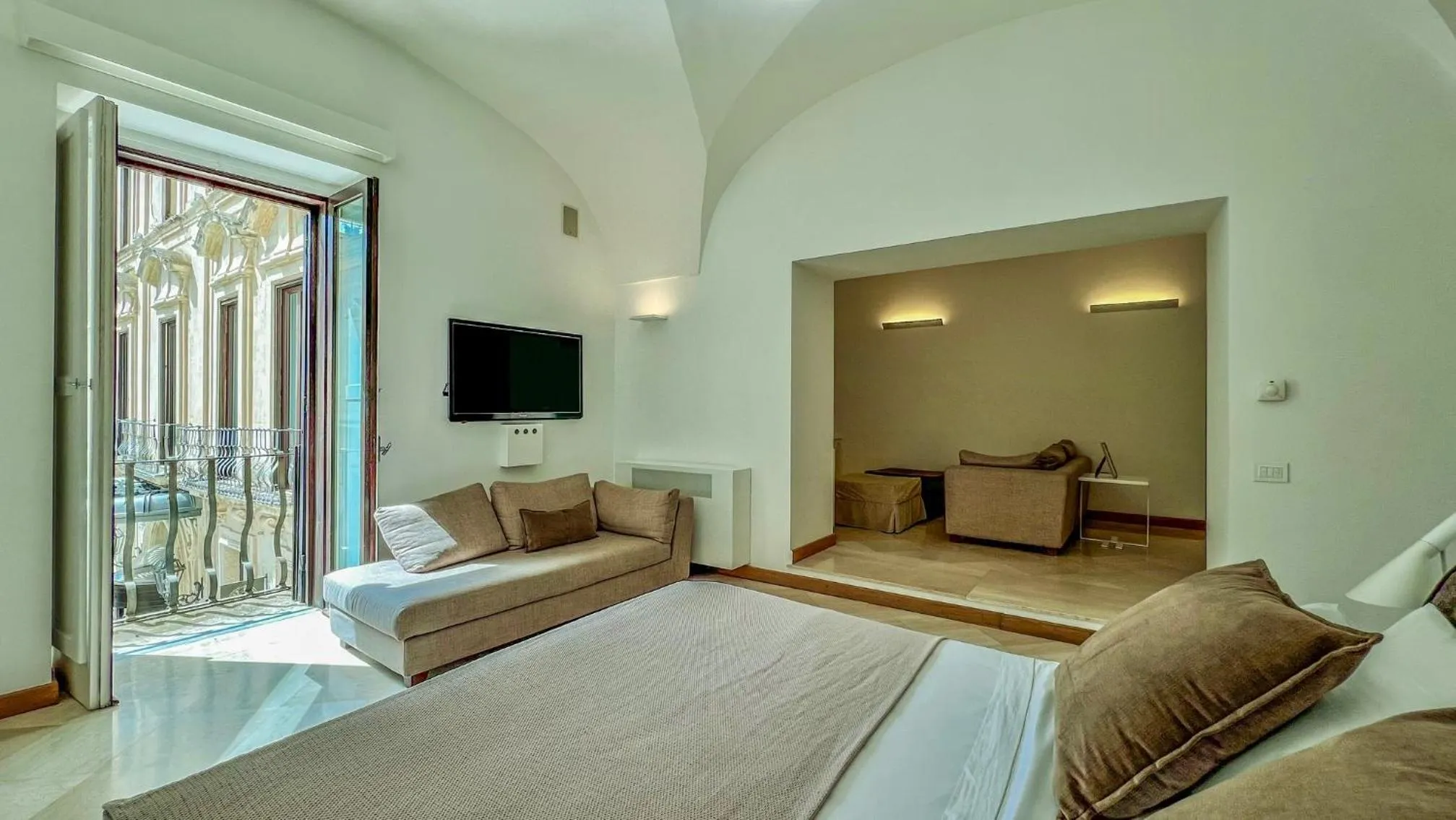 Bed in Santacroce Luxury Rooms