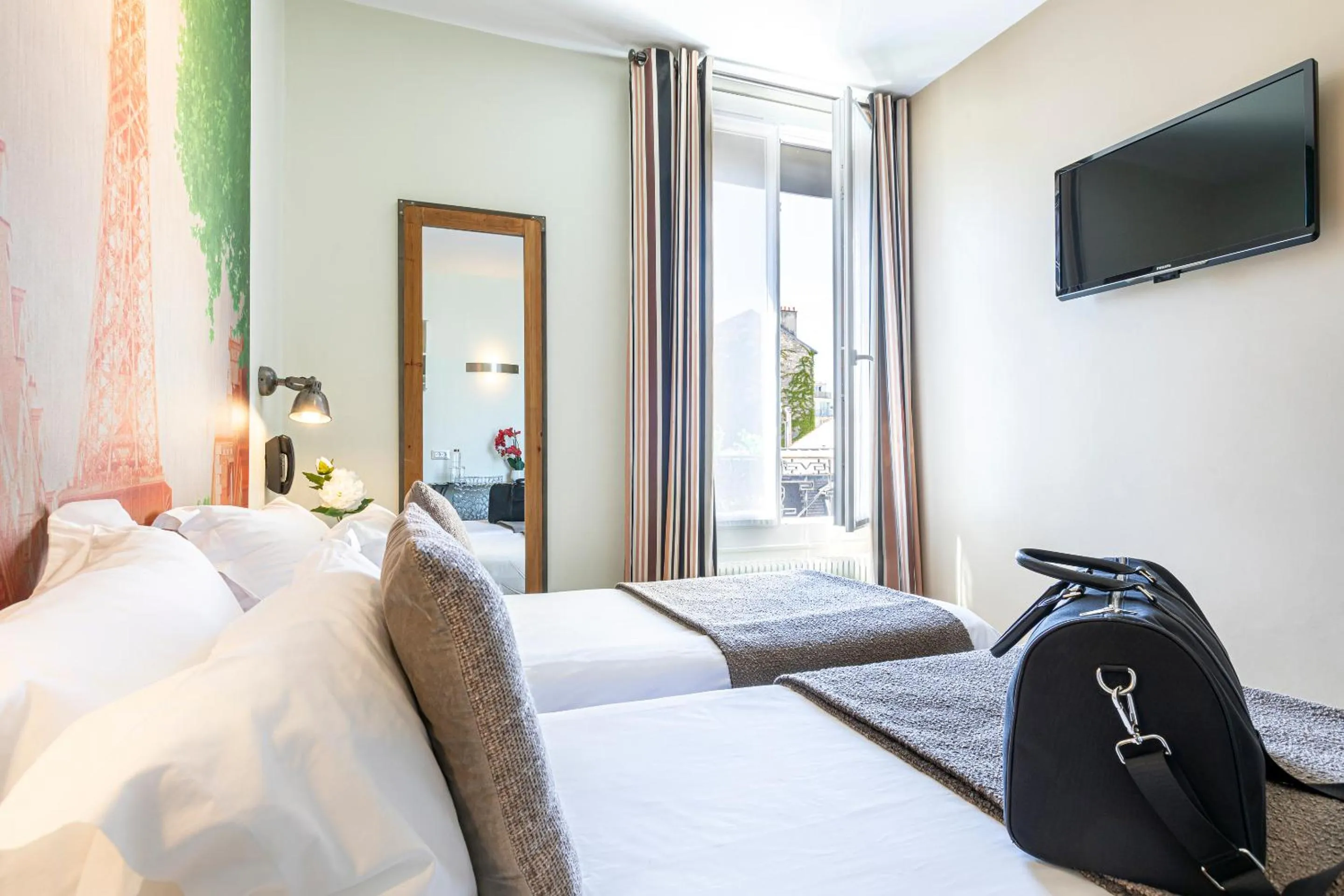 Bed in Hotel Alpha Paris Eiffel by Patrick Hayat