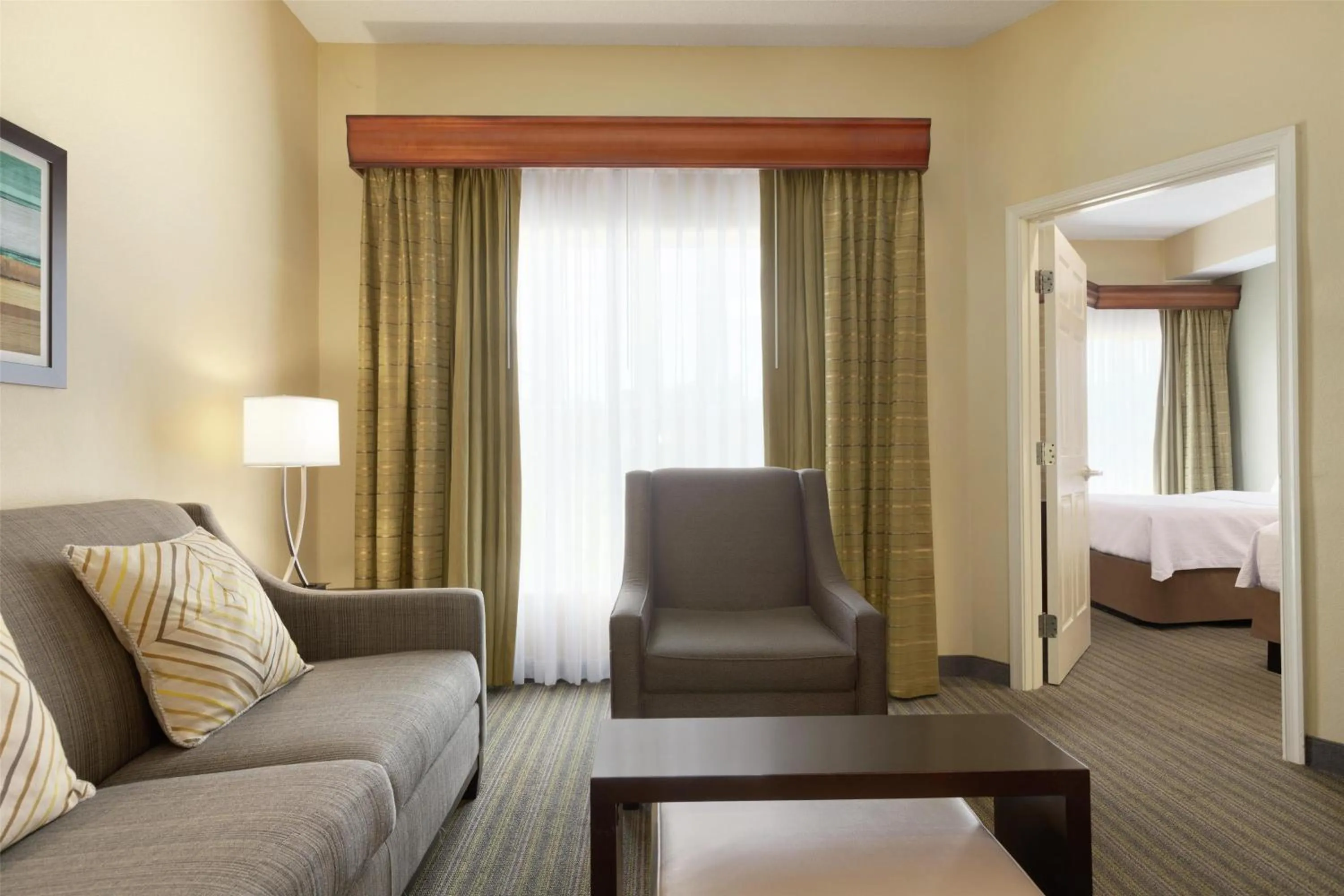 Living room, Bed in Homewood Suites by Hilton St. Petersburg Clearwater