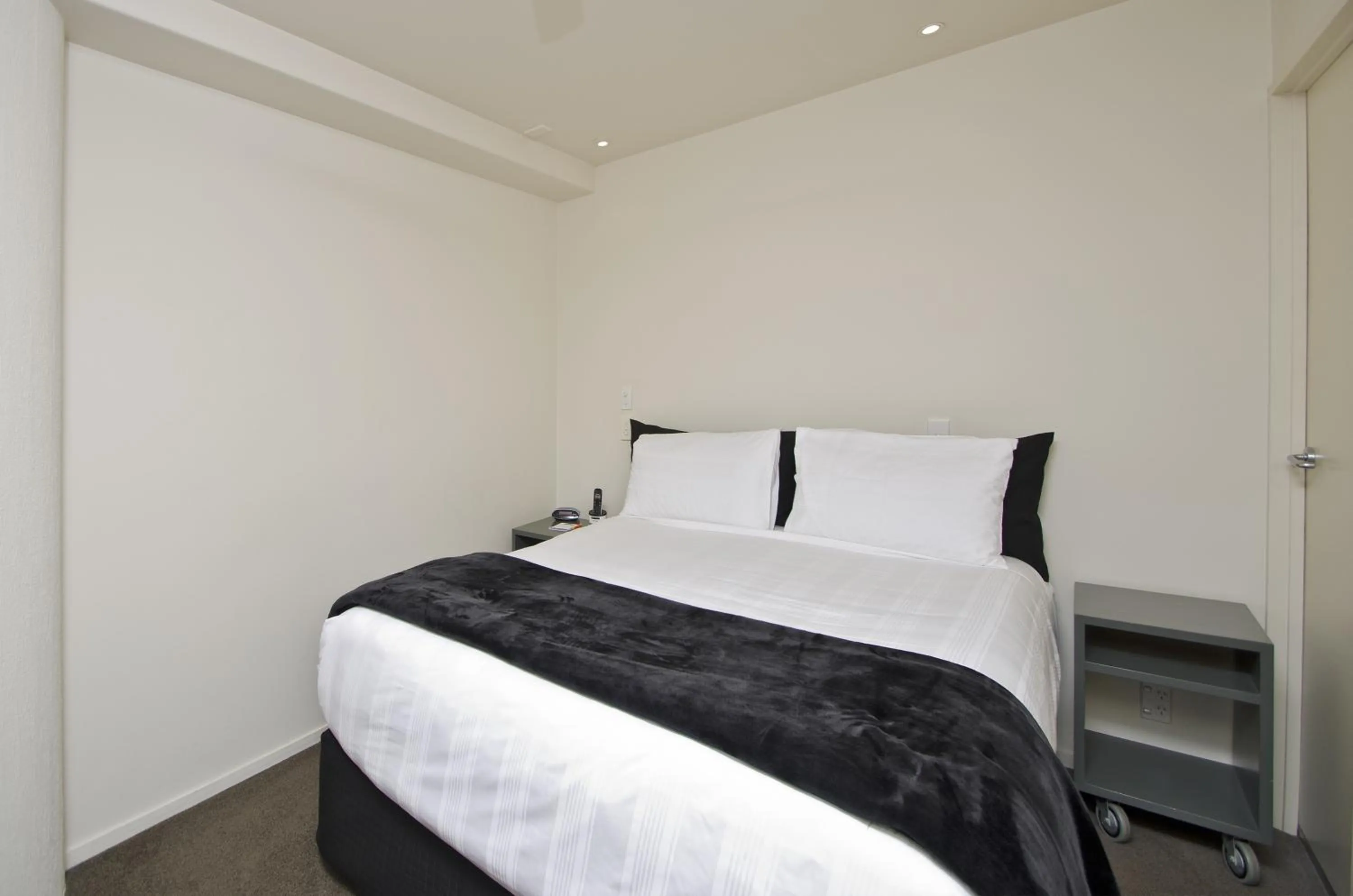 Bed in Pavilion Beachfront Apartments