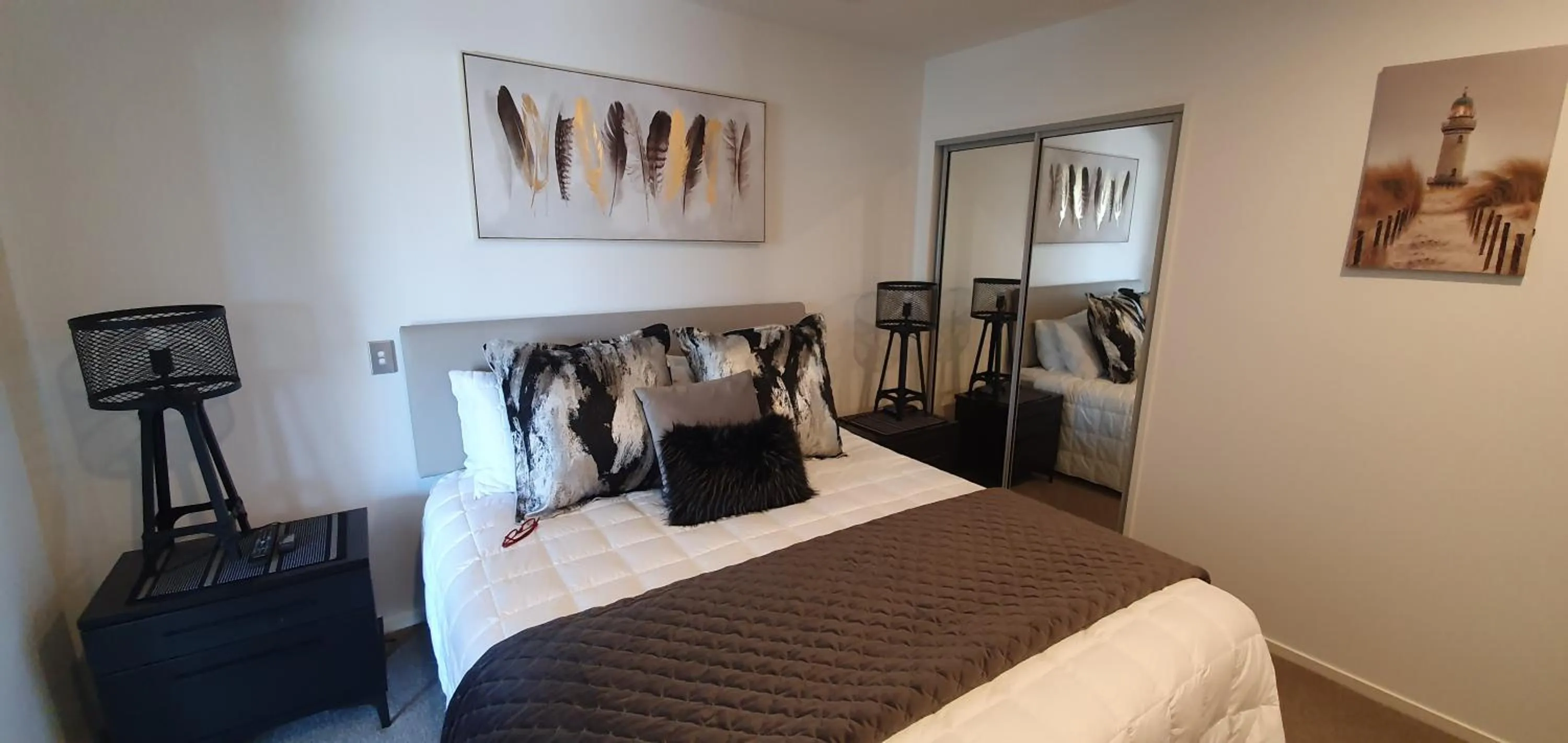 Bed in Pavilion Beachfront Apartments