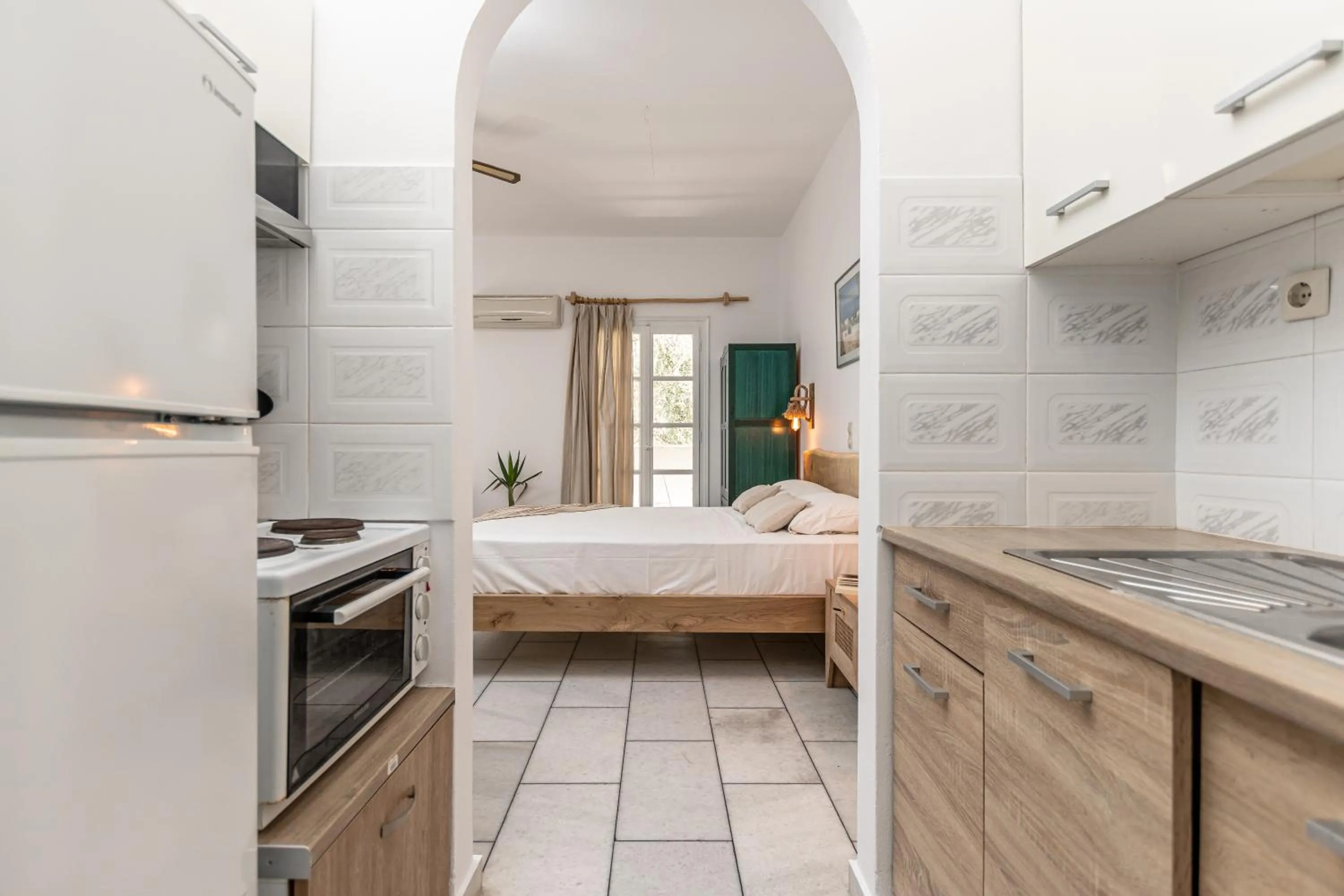 kitchen, Bed in Studios Vrettos Beachfront Hotel