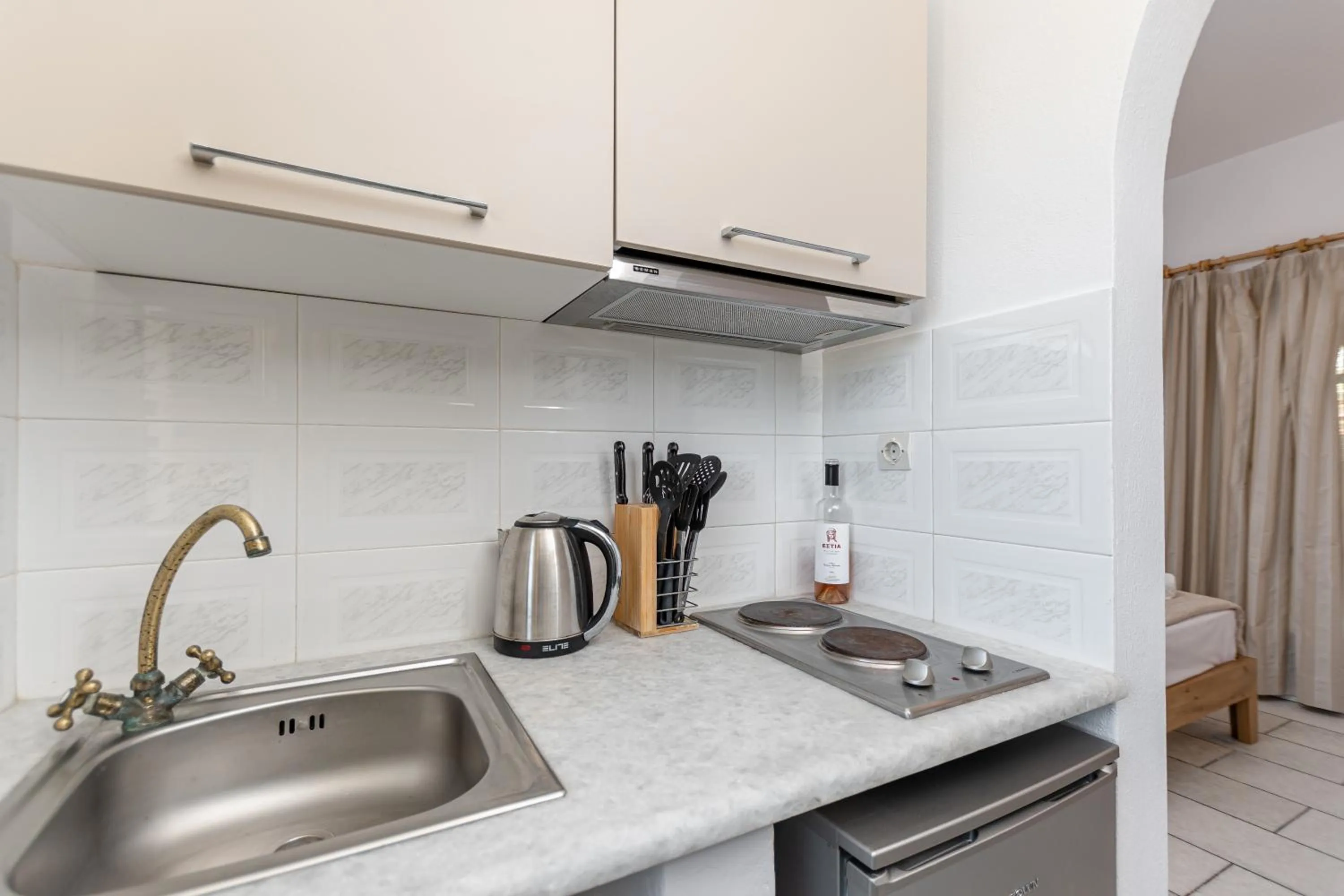 kitchen in Studios Vrettos Beachfront Hotel