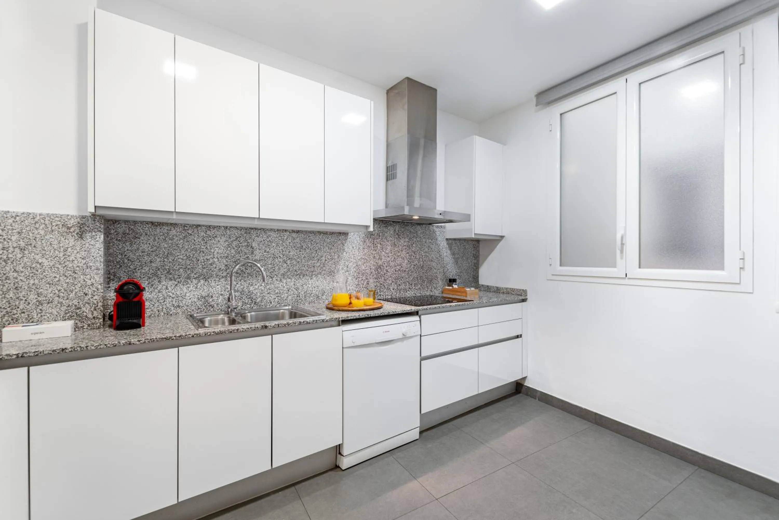 Kitchen or kitchenette in The Corner Apartments by Aspasios