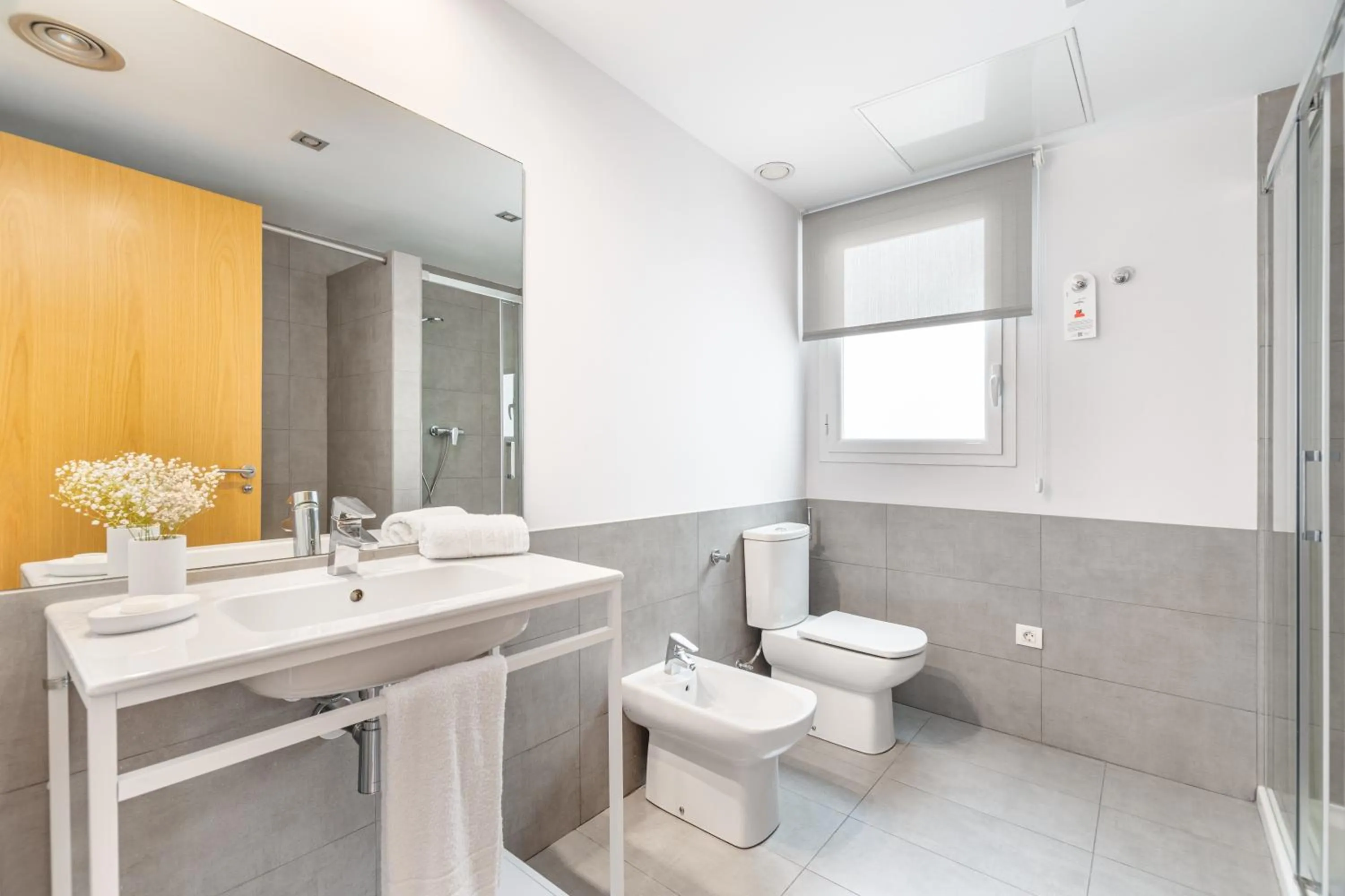 Bathroom in The Corner Apartments by Aspasios