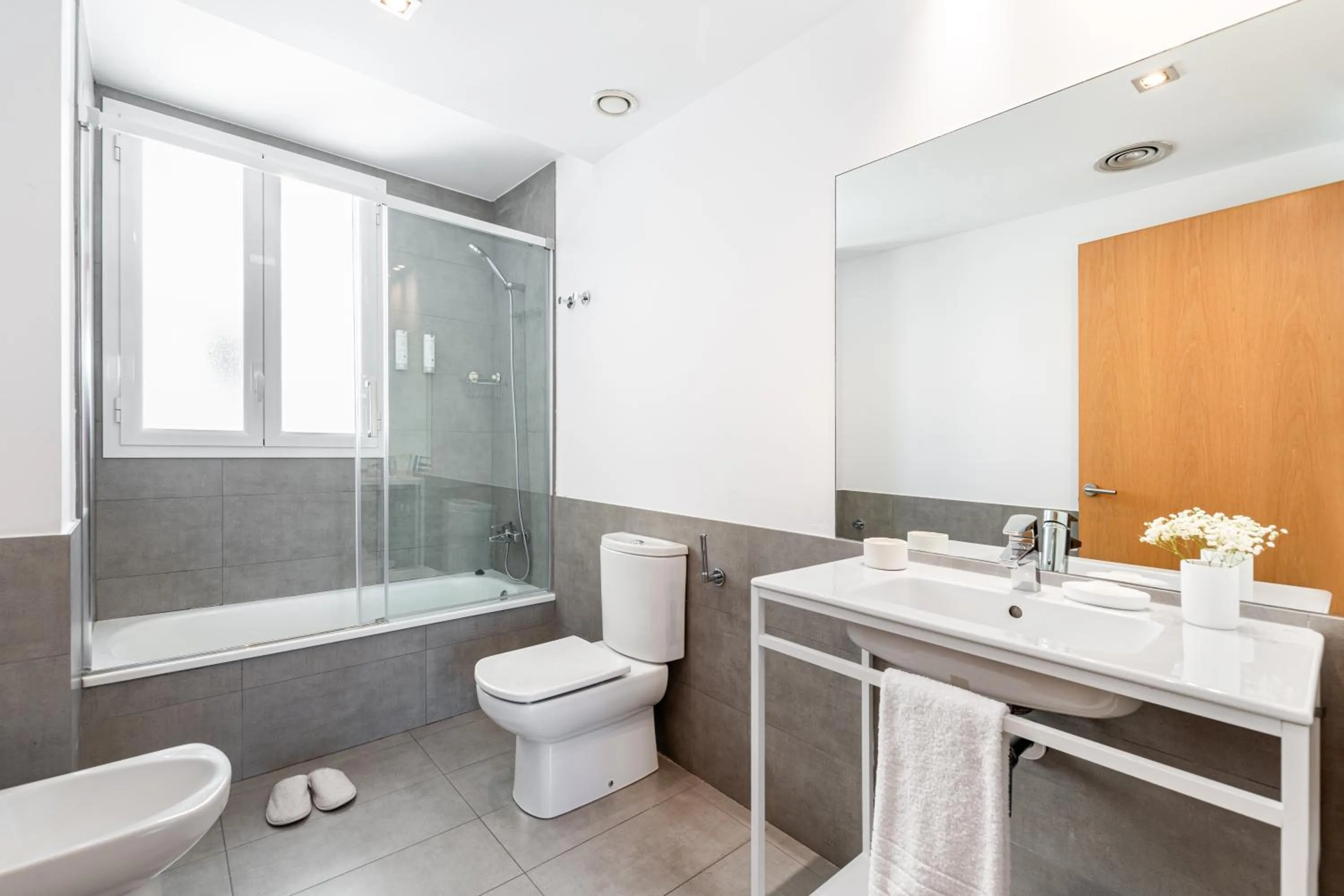 Bathroom in The Corner Apartments by Aspasios