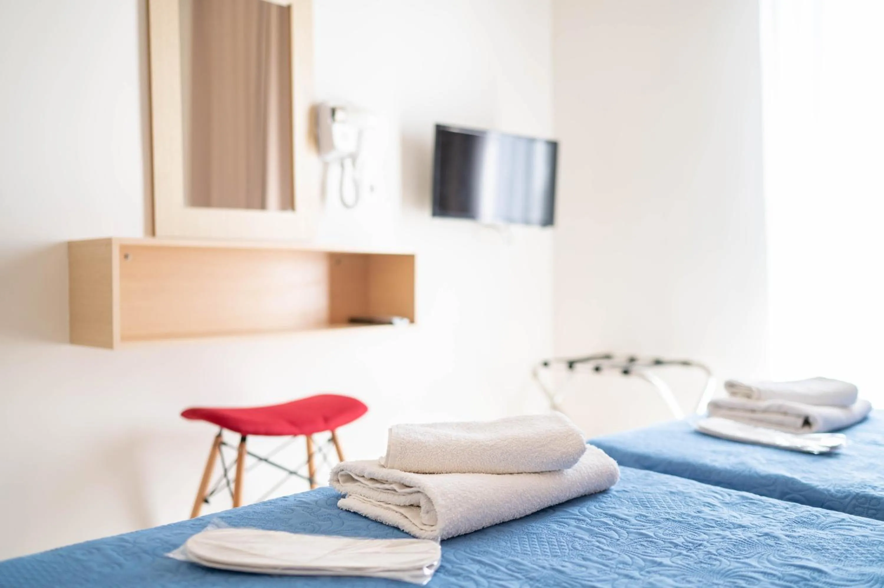 Bed in Achilleas Hotel Apartments