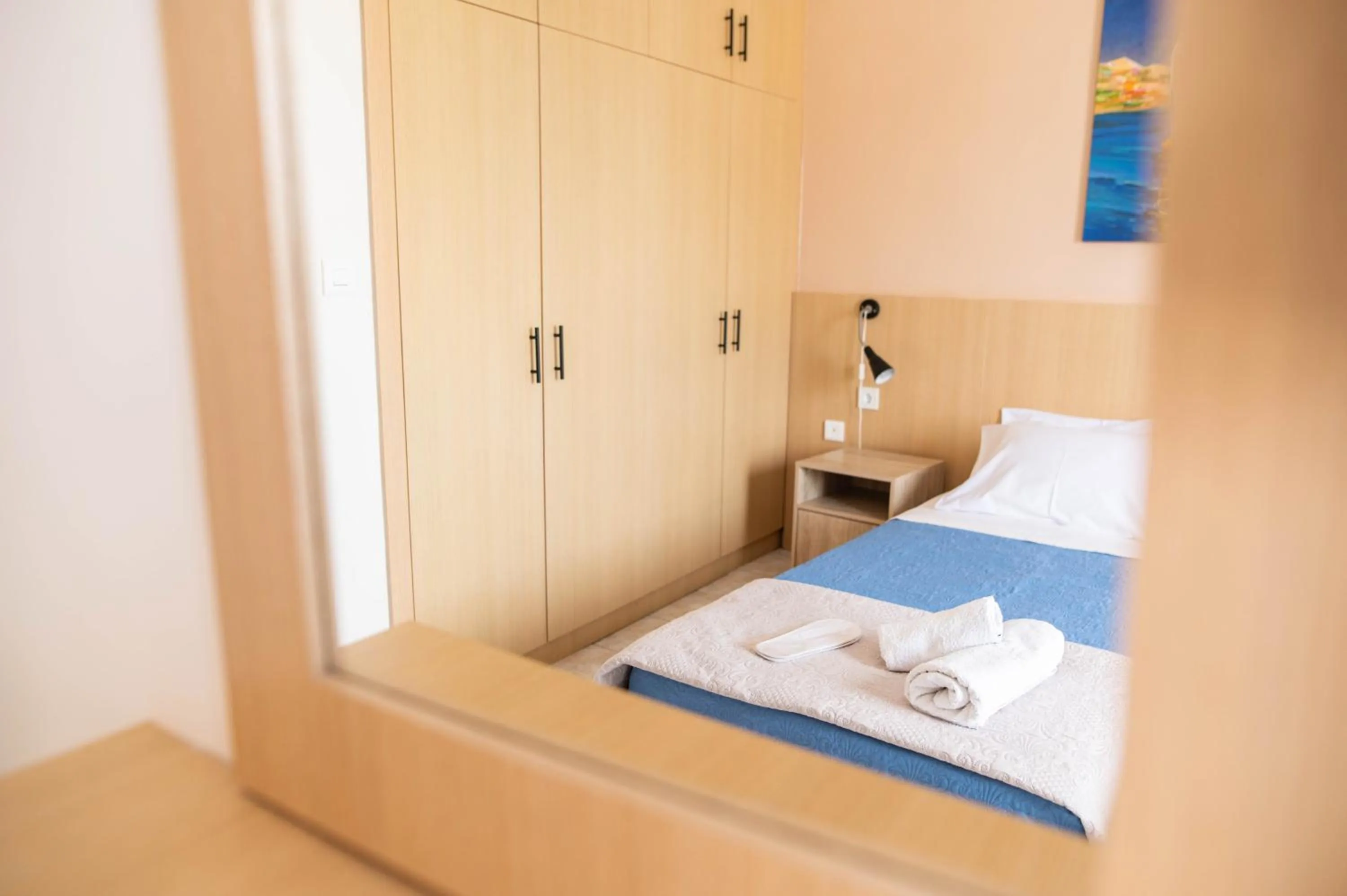 Bed in Achilleas Hotel Apartments