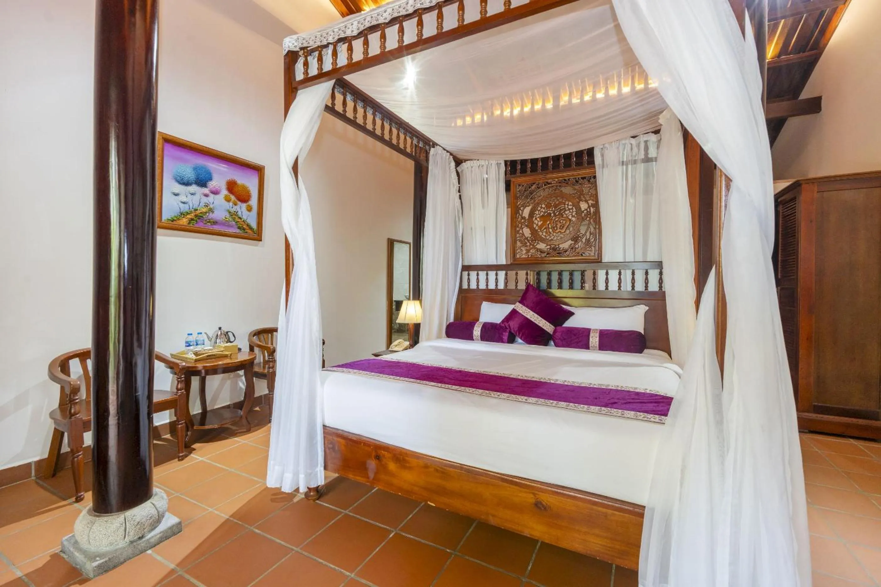 Bed in Maison Du VietNam Resort & Spa