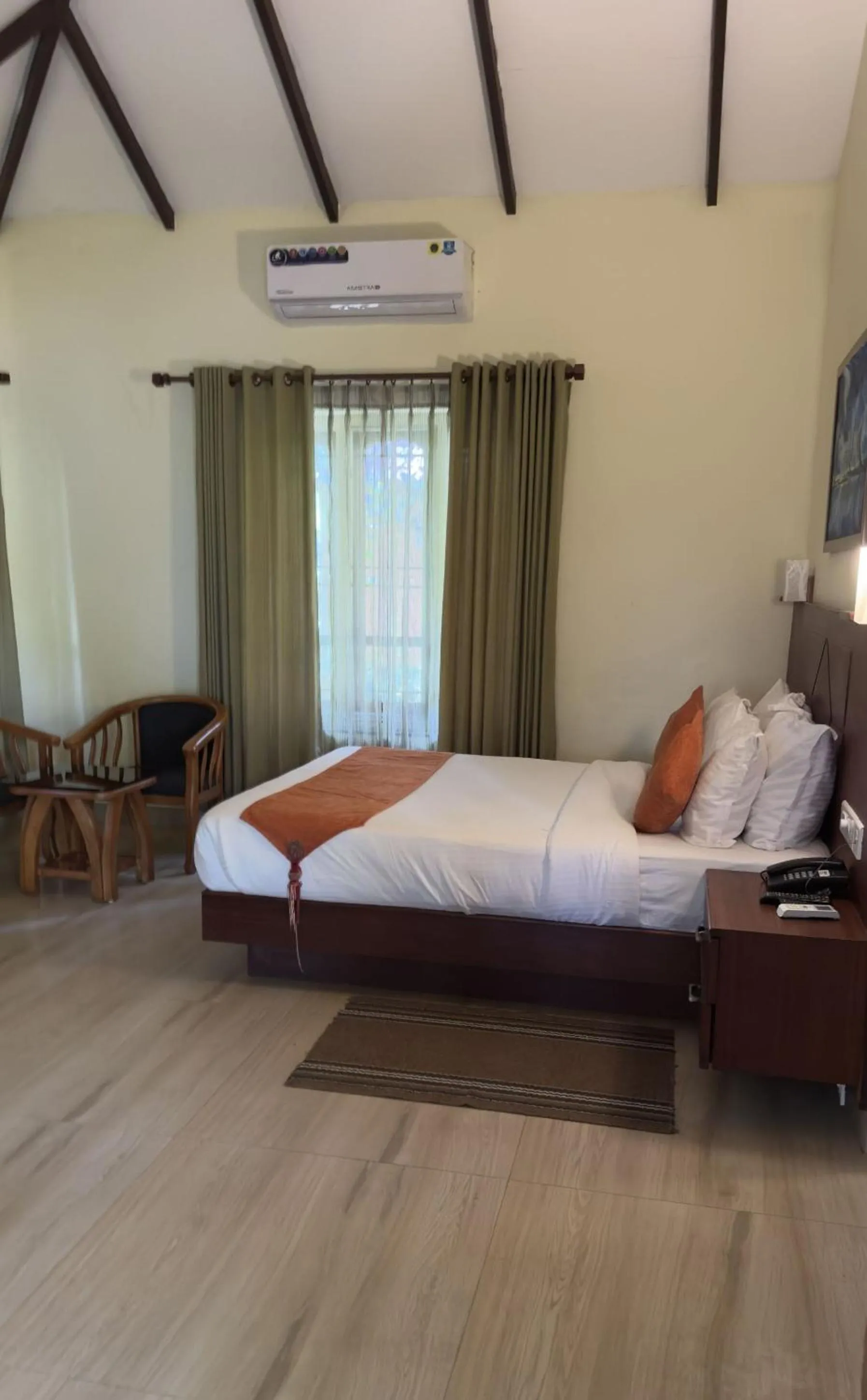 Seating area, Bed in Indeevara Luxury Resort and Spa, Wayanad