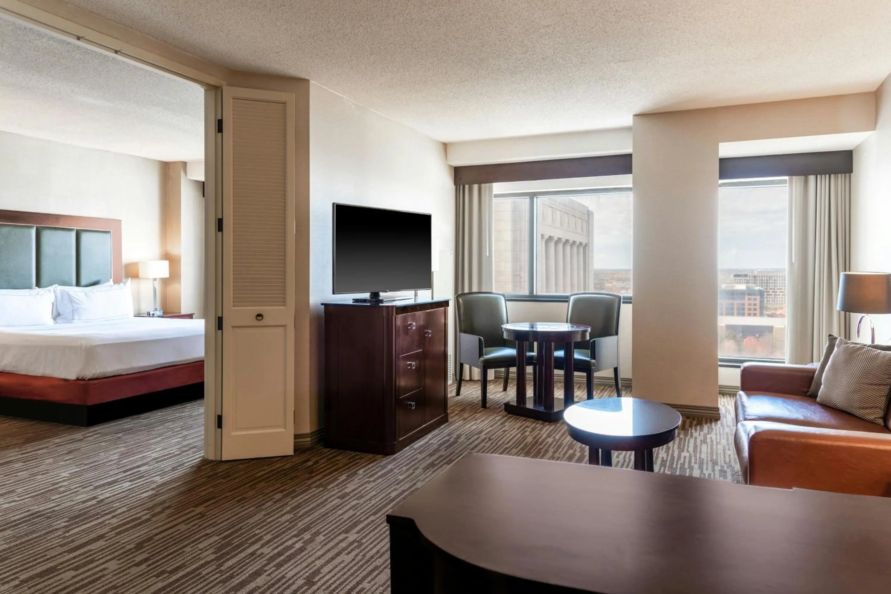 Photo of the whole room, Bed in The Capital Suites Hotel