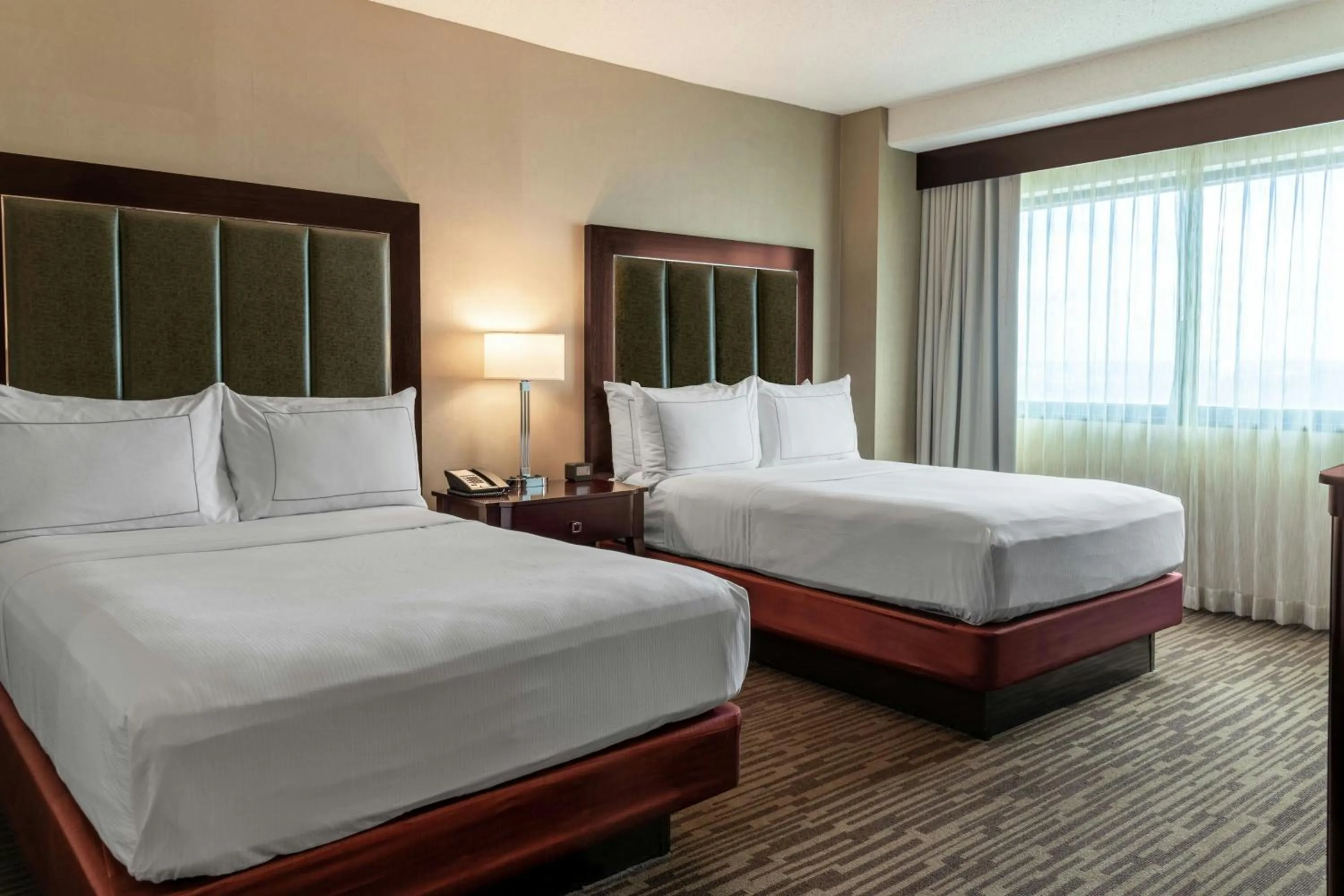 Bedroom, Bed in The Capital Suites Hotel