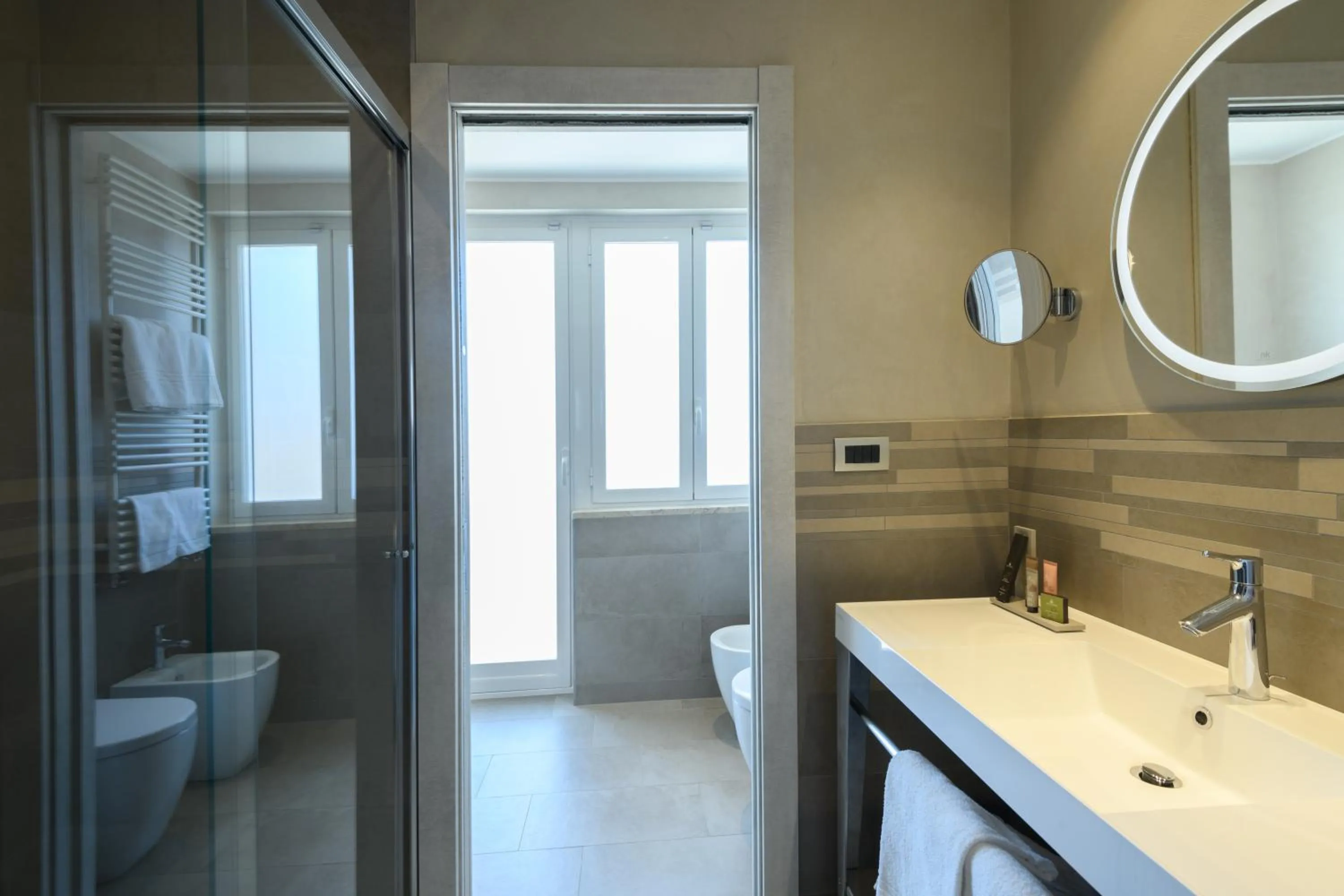 Bathroom in Hotel & Apartments Sasso