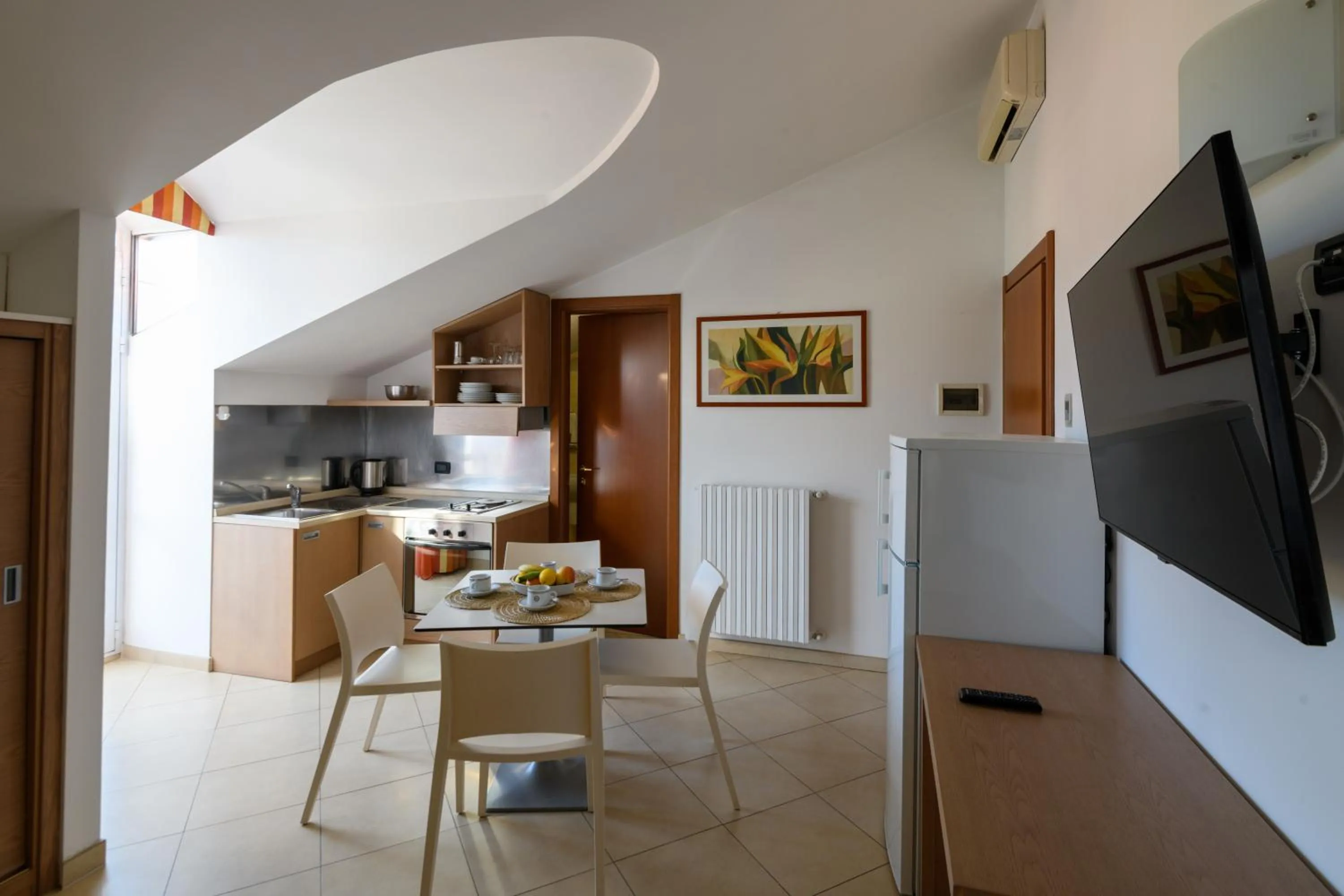 Kitchen or kitchenette in Hotel & Apartments Sasso