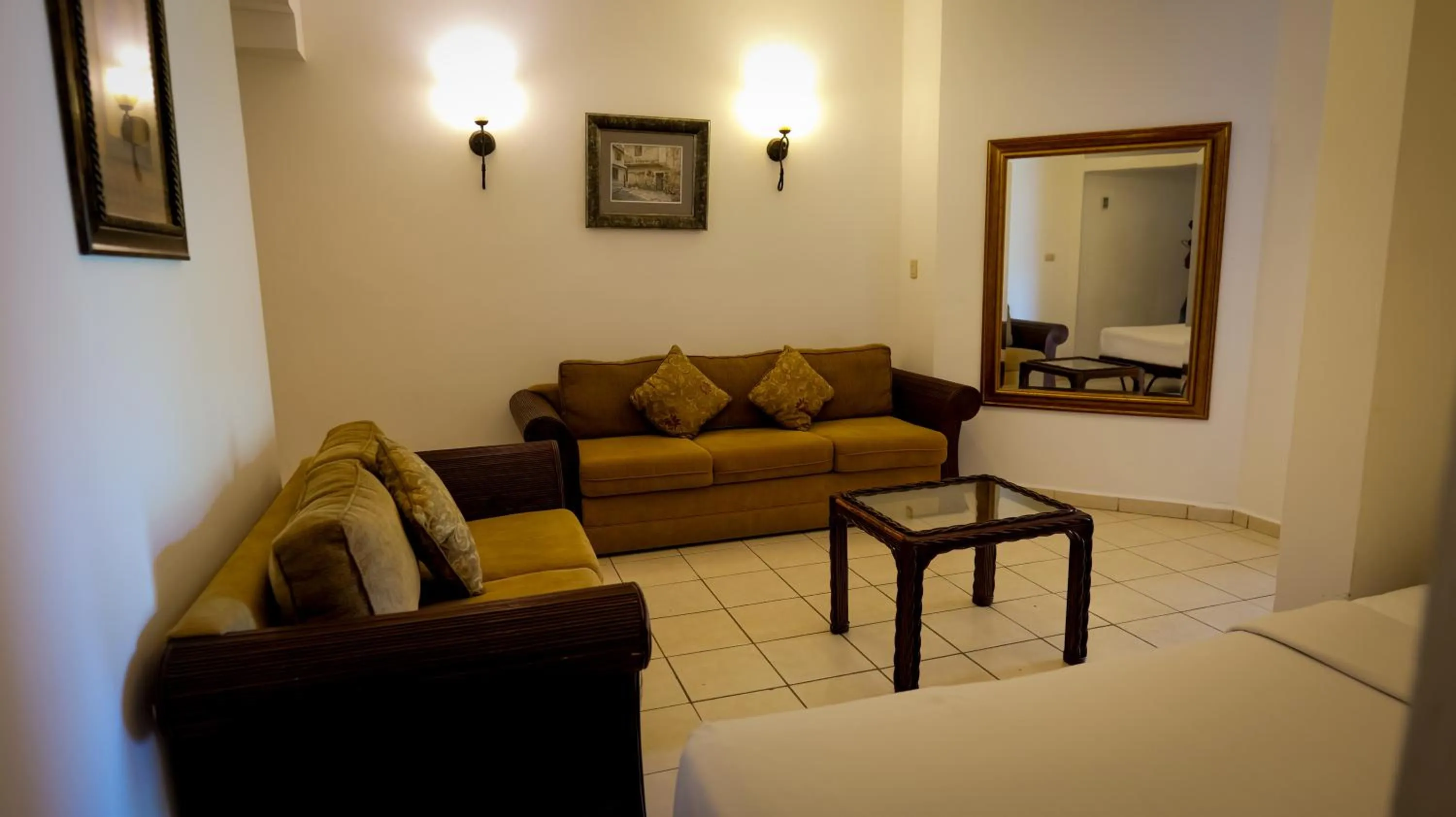 Living room, Bed in La Ensenada Beach Resort