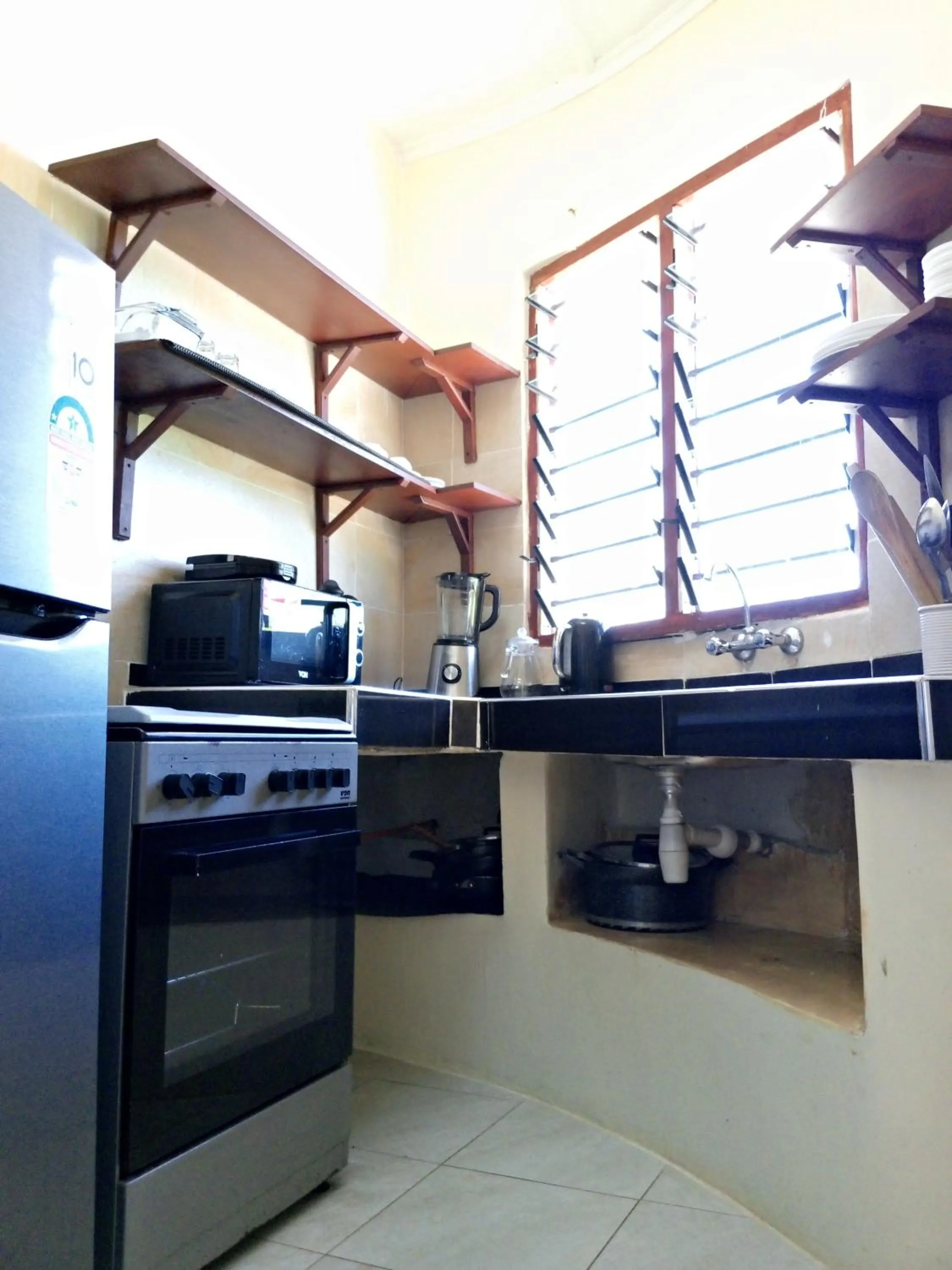 Kitchen or kitchenette in Tahira Villa
