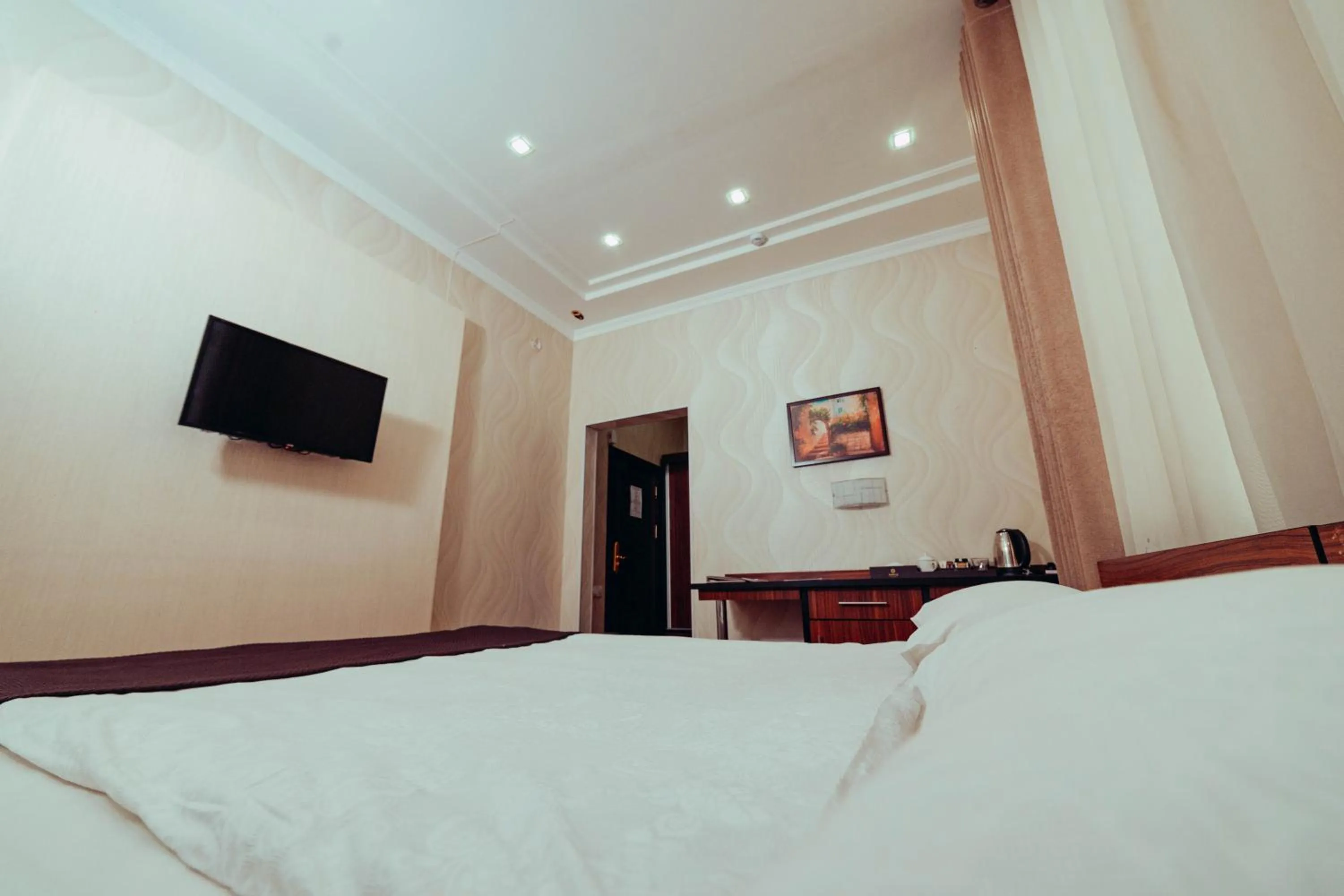 Bed in Asmald Palace Hotel