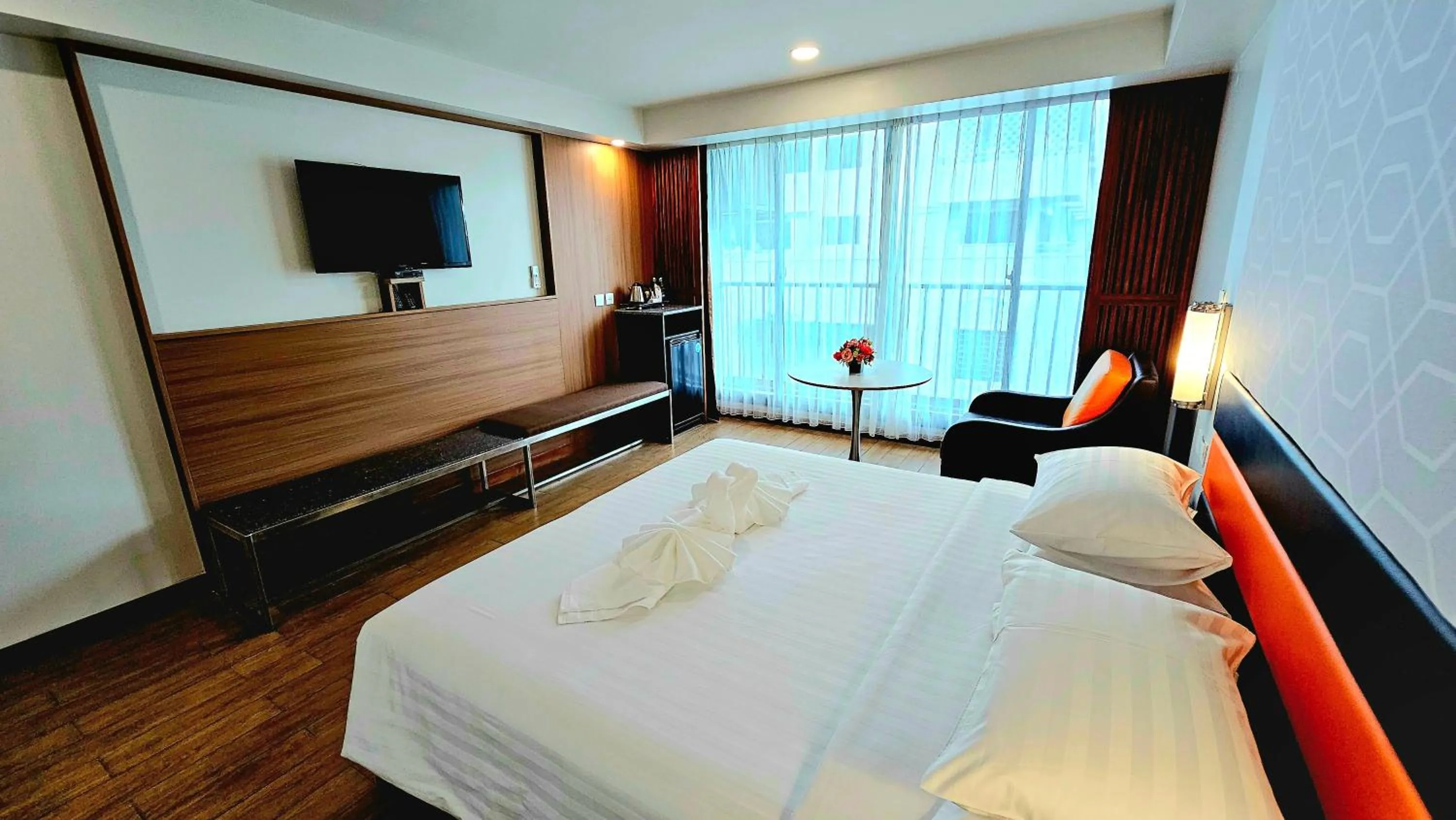 Bed in Dynasty Grande Hotel