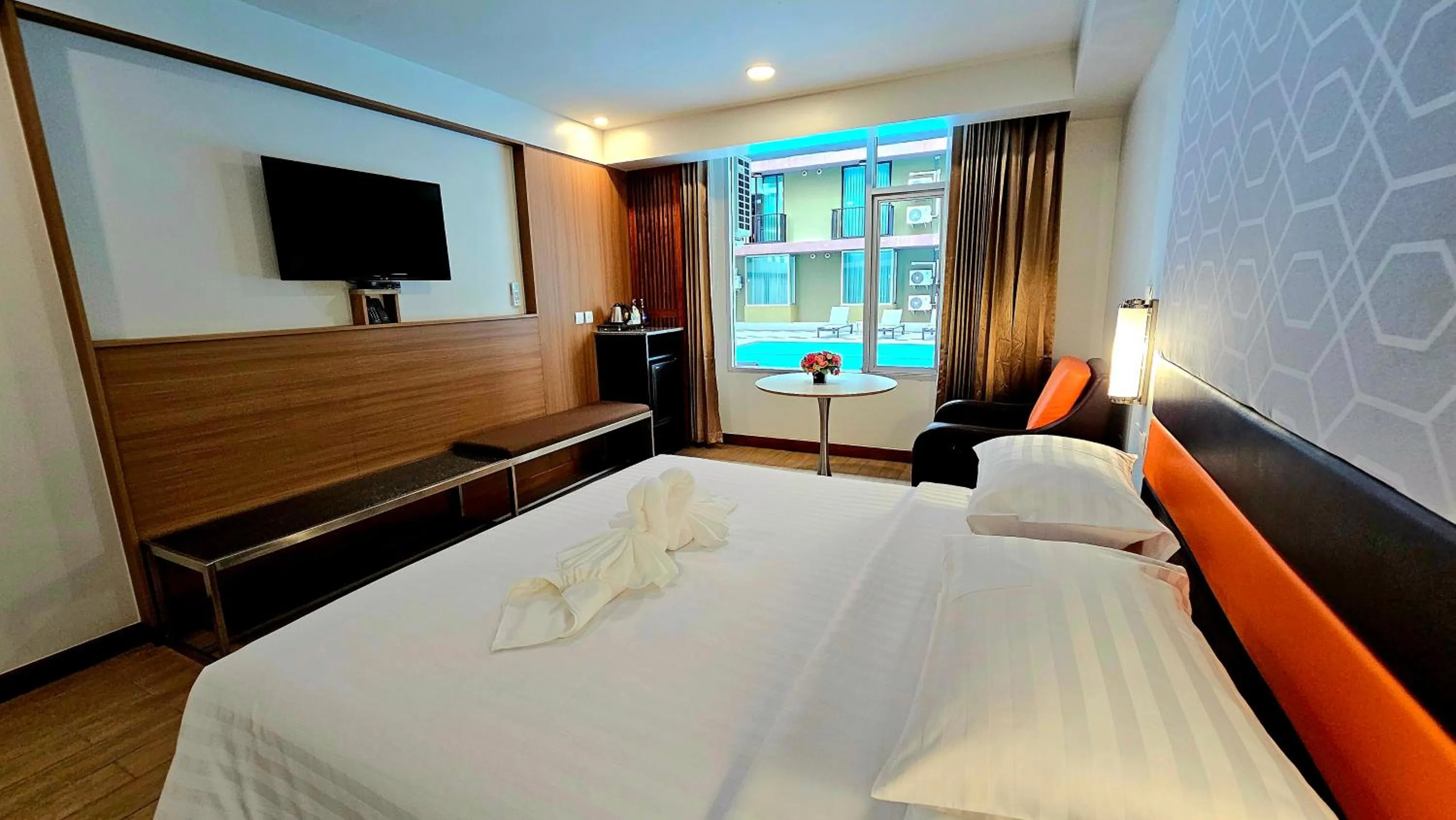 Bed in Dynasty Grande Hotel