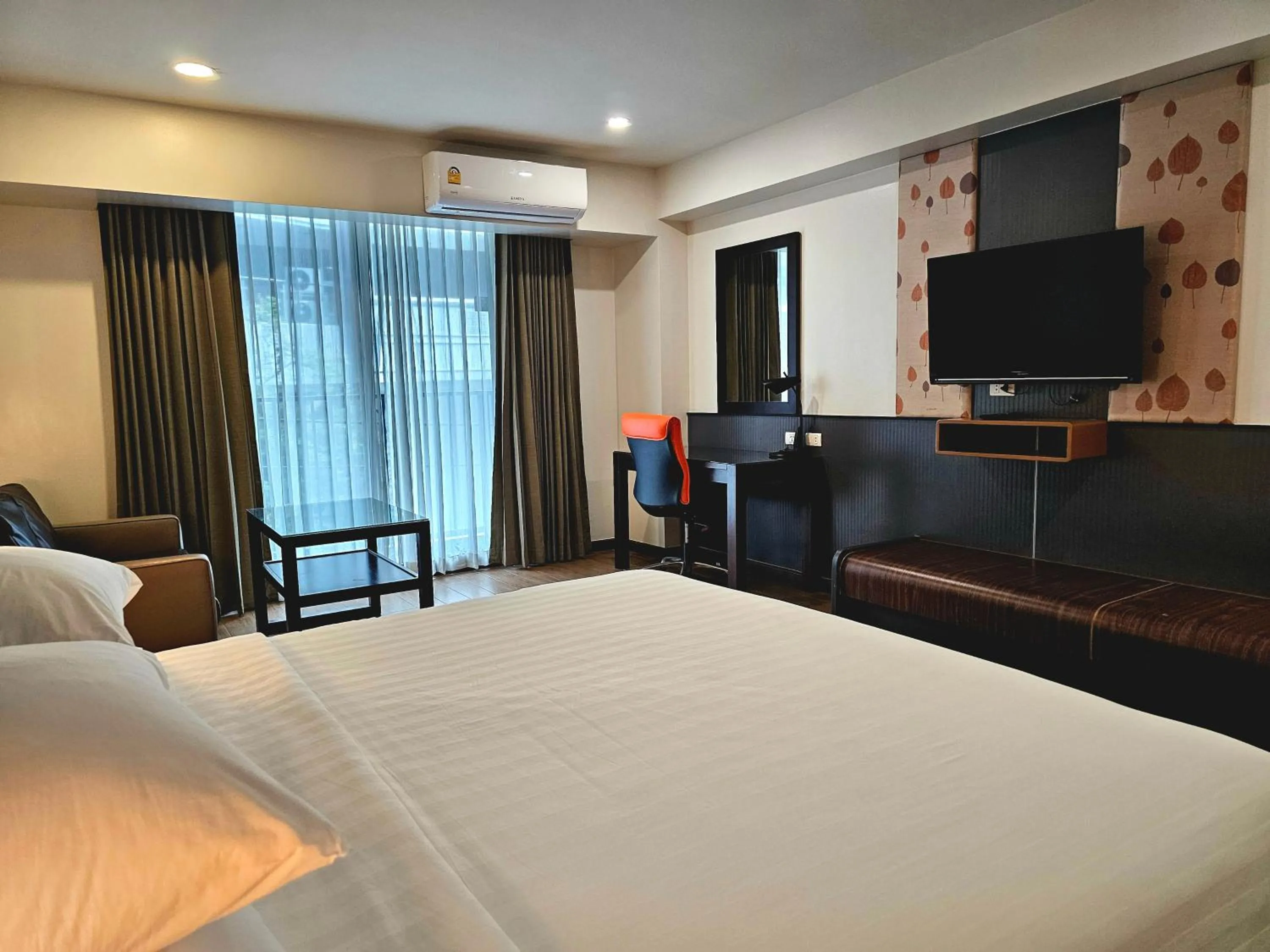 Bed in Dynasty Grande Hotel