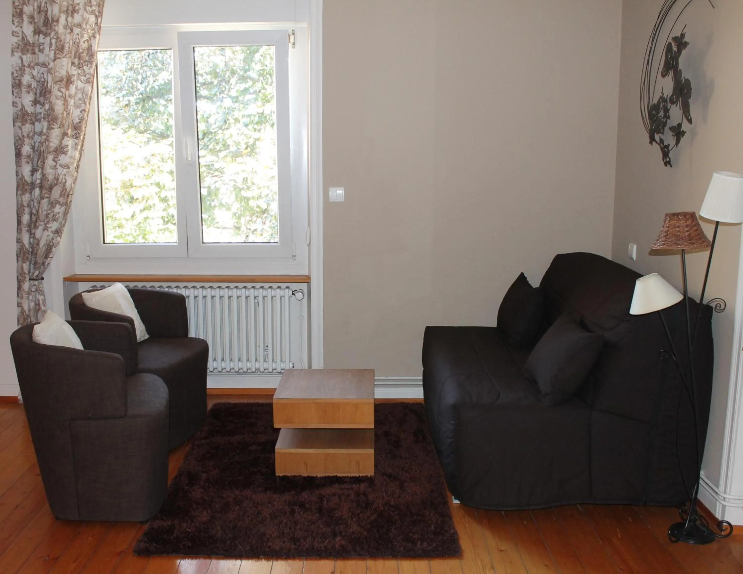 Seating area in Aux Berges de la Thur