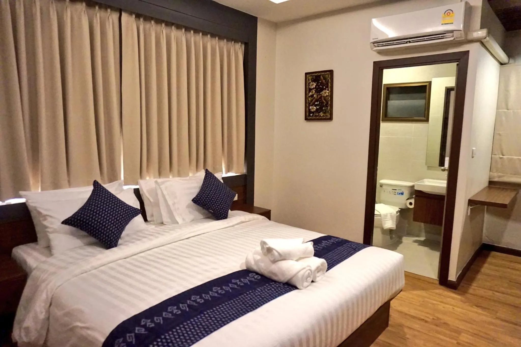 Bed in Lima Lanna Hotel