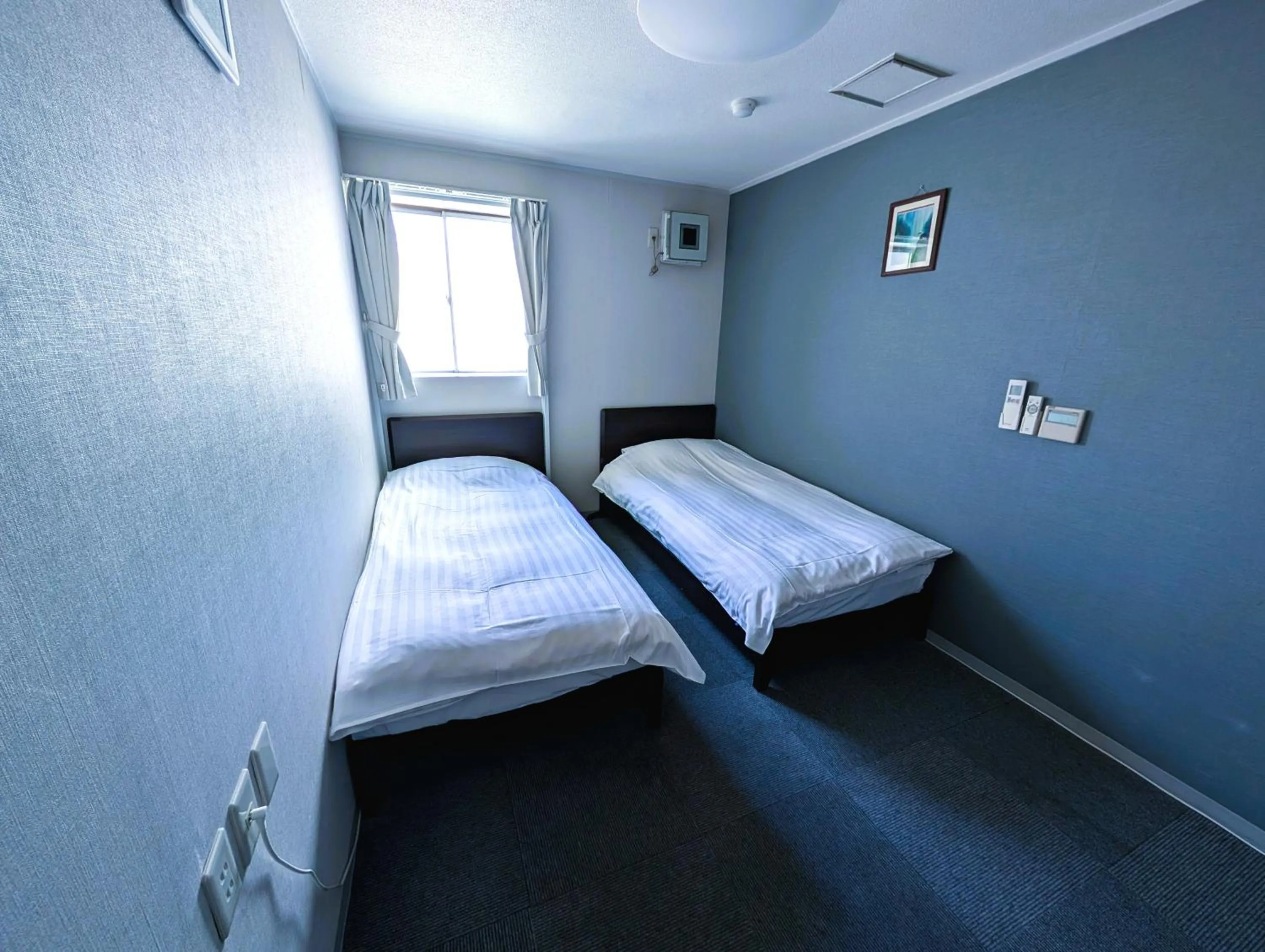 Bed in The Shin-Okubo International Hotel