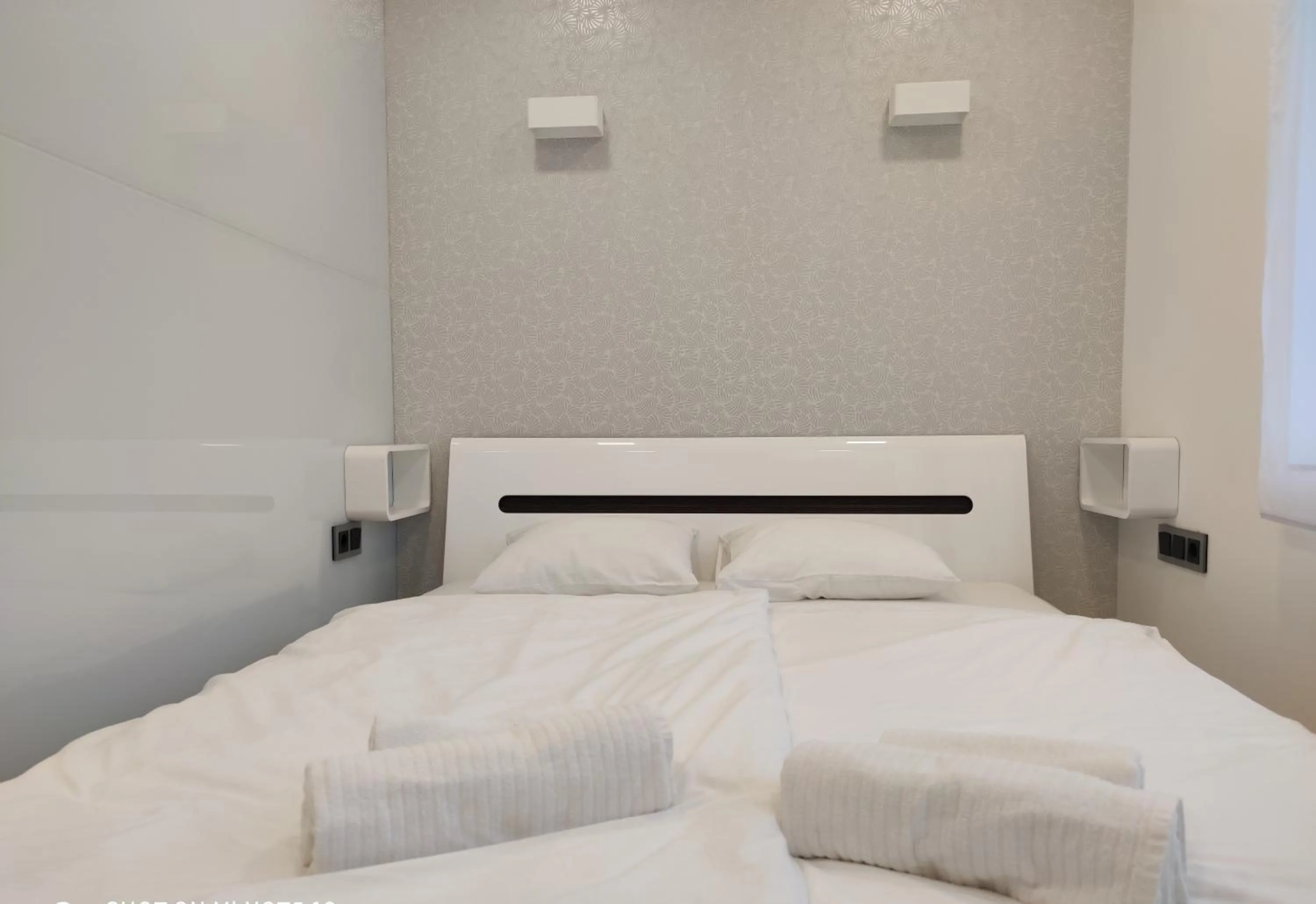 Bed in AQUA SOLAR APARTMANHÁZ