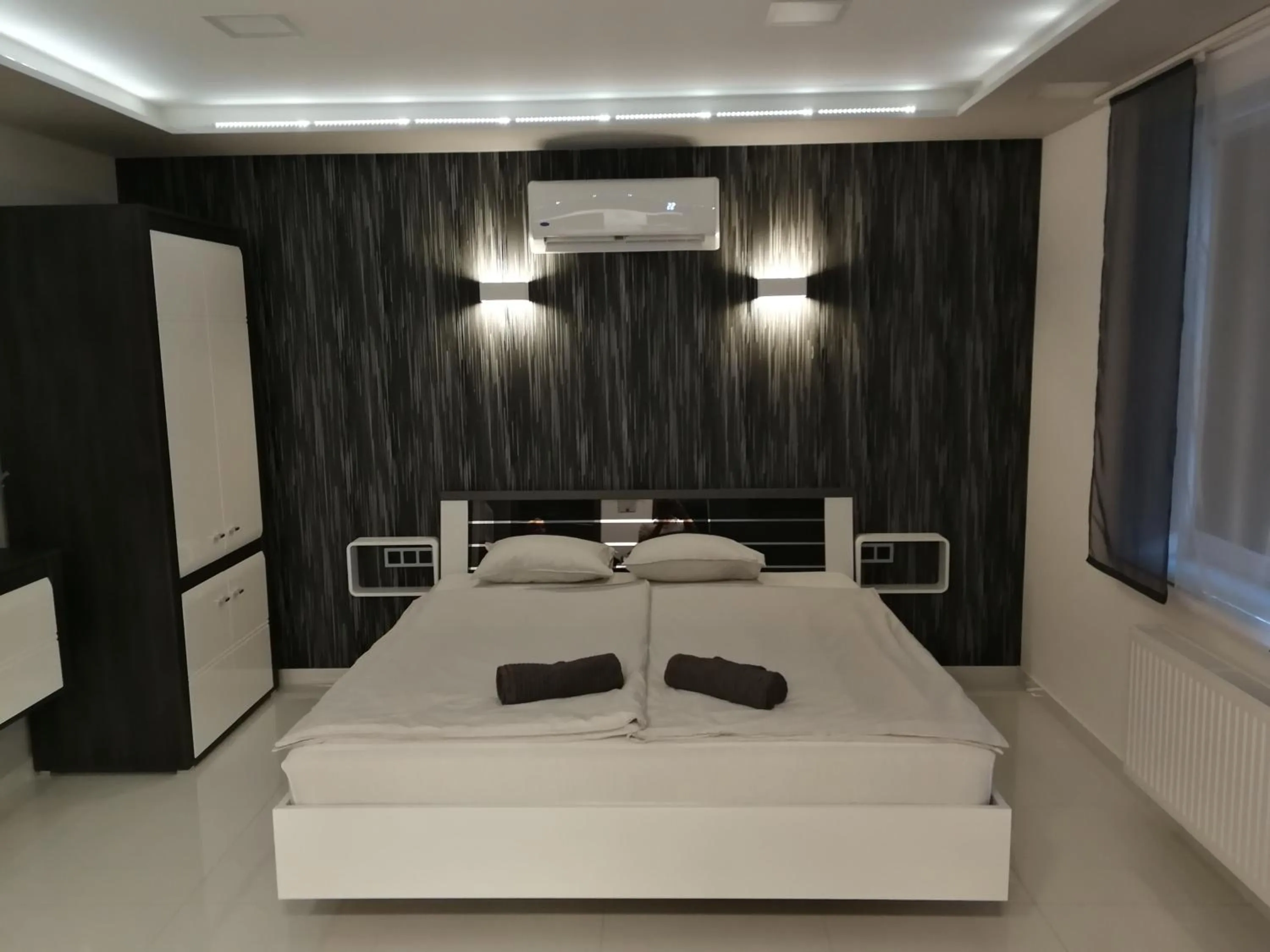 Bed in AQUA SOLAR APARTMANHÁZ