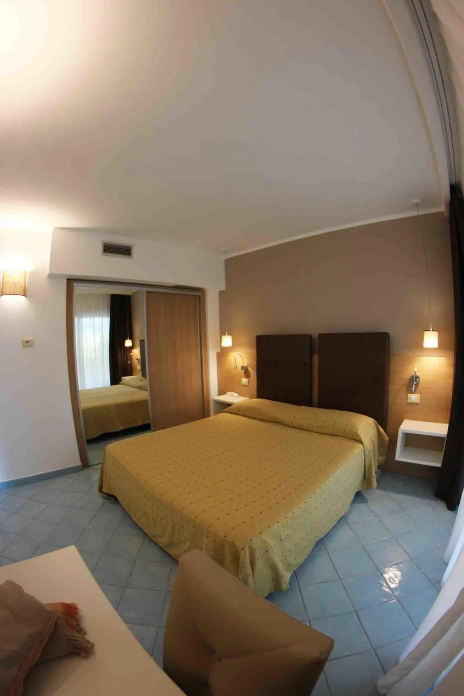 Photo of the whole room, Bed in Baia del Godano Resort & Spa