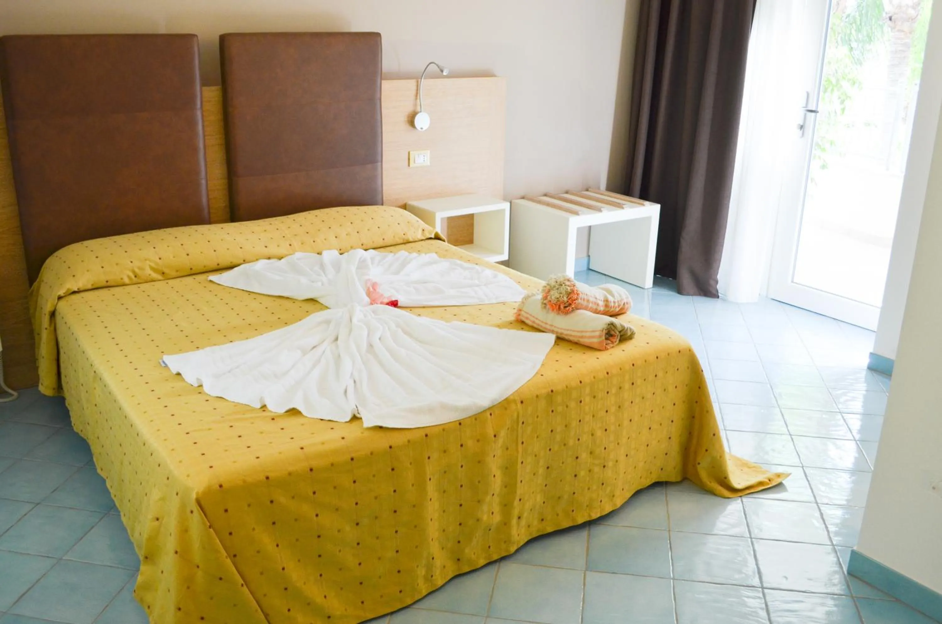 Photo of the whole room, Bed in Baia del Godano Resort & Spa