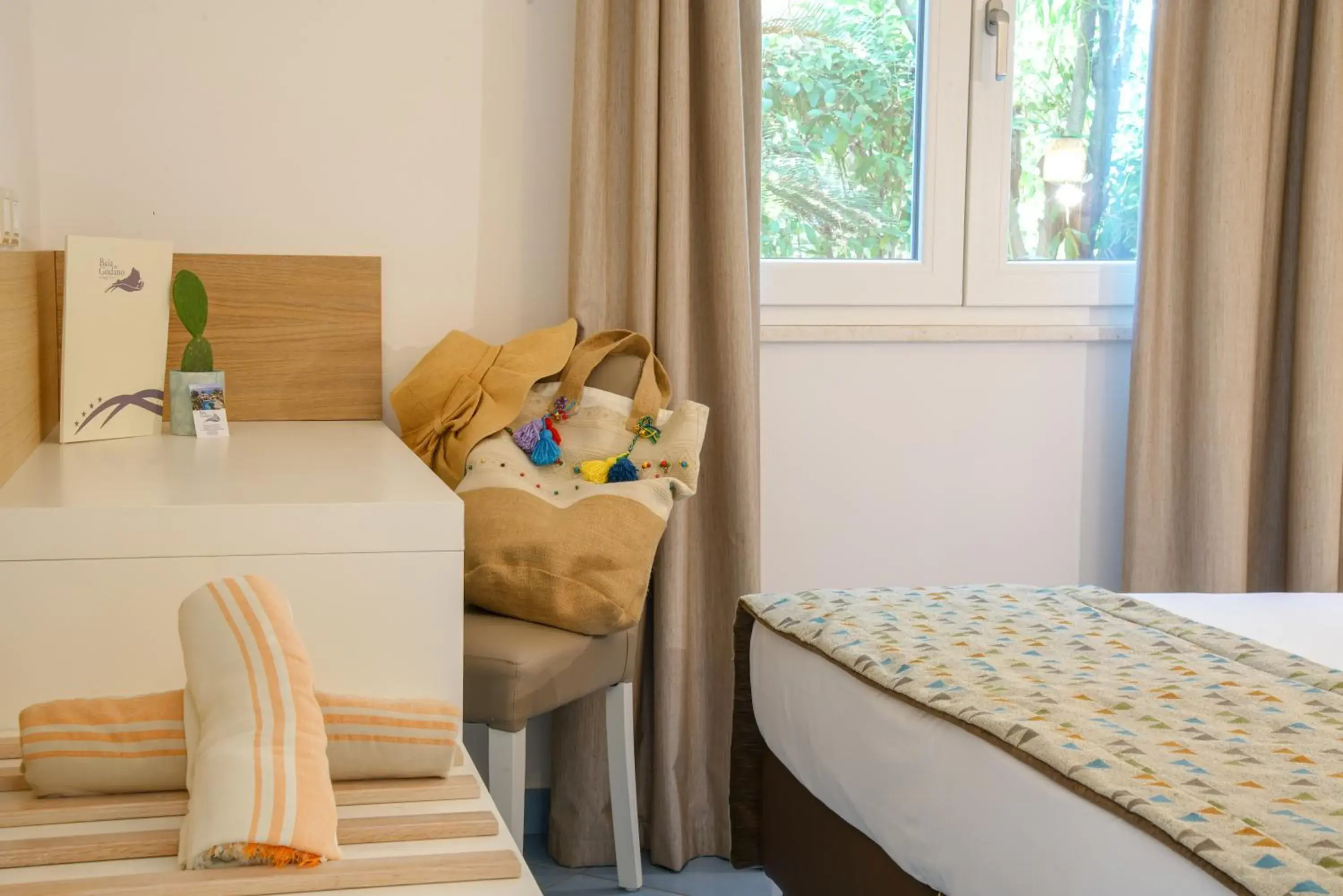 Bed in Baia del Godano Resort & Spa Bed in Baia del Godano Resort & Spa