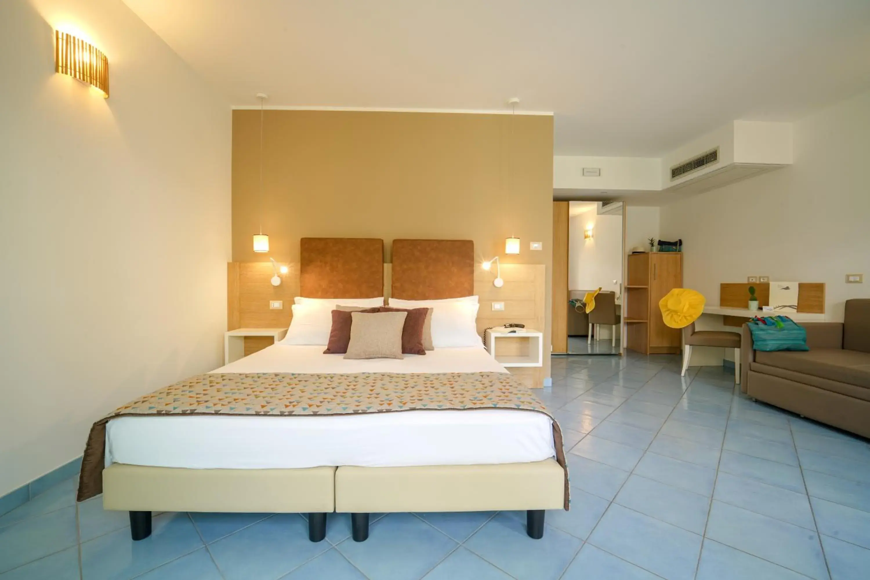 Bed in Baia del Godano Resort & Spa Bed in Baia del Godano Resort & Spa