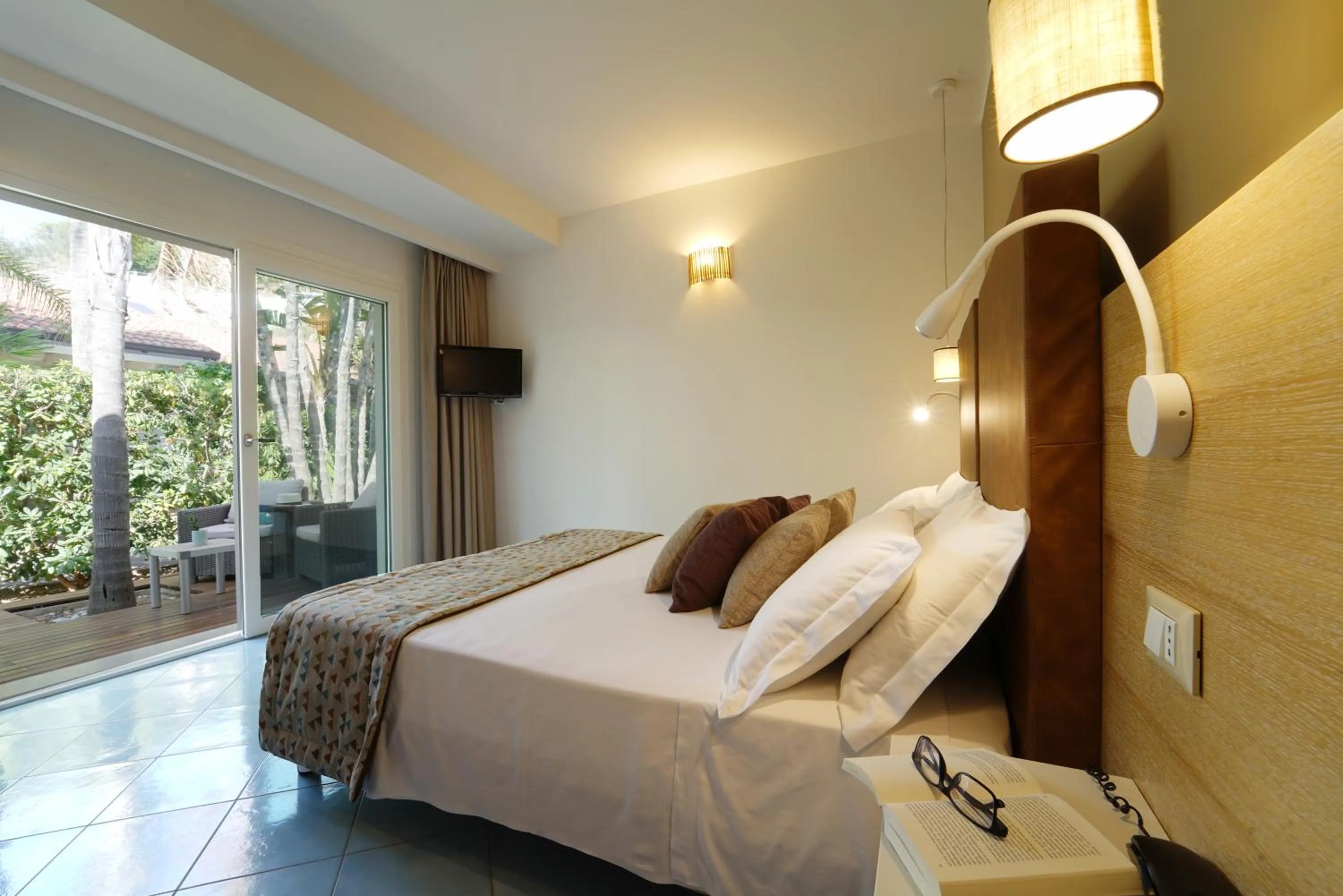 Photo of the whole room, Bed in Baia del Godano Resort & Spa