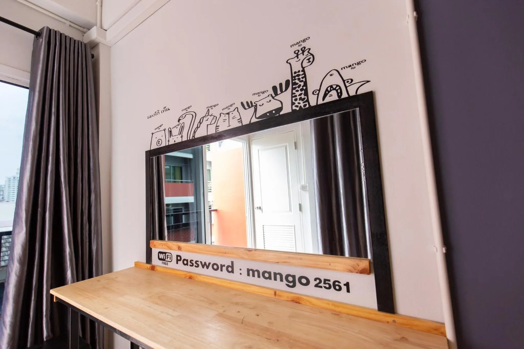 Property logo or sign in Mango 10 House