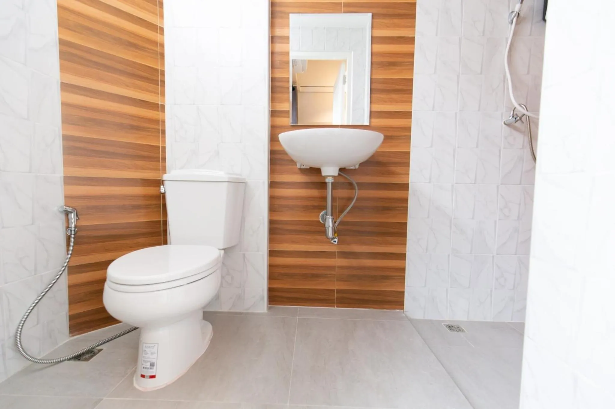 Toilet in Mango 10 House