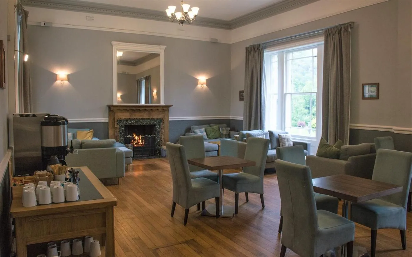 Communal lounge/ TV room in Brathay Hall - Brathay Trust