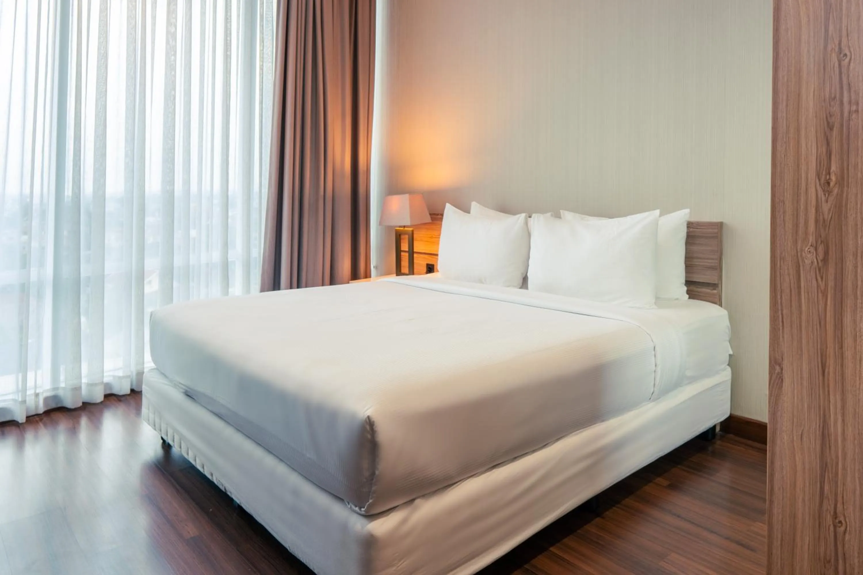 Bed in Azana Suites Hotel Antasari