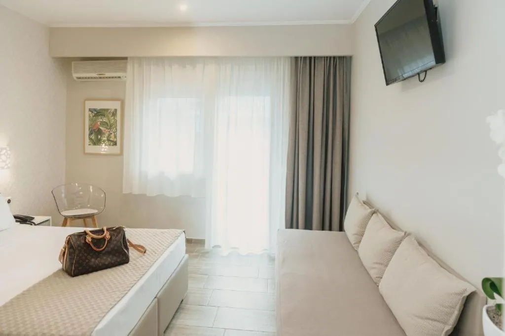 Photo of the whole room, Bed in Ammos Beach Seaside Luxury Suites Hotel