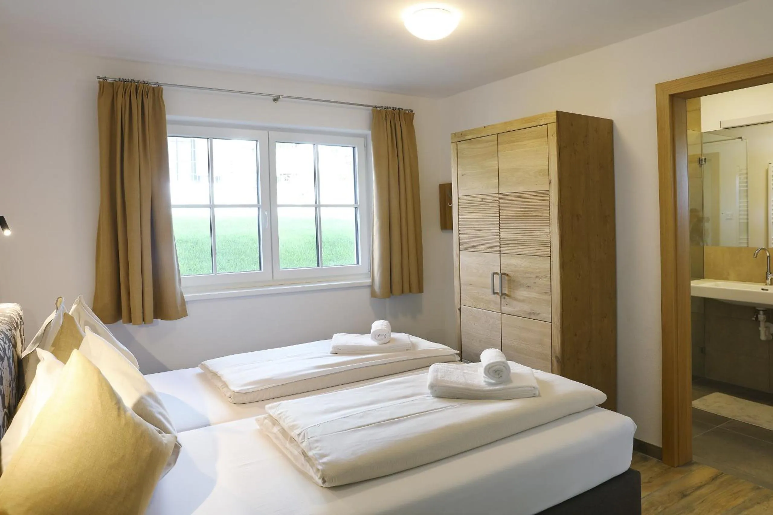 Bed in Tauernsuites Mitterwirt by ALPS RESORTS