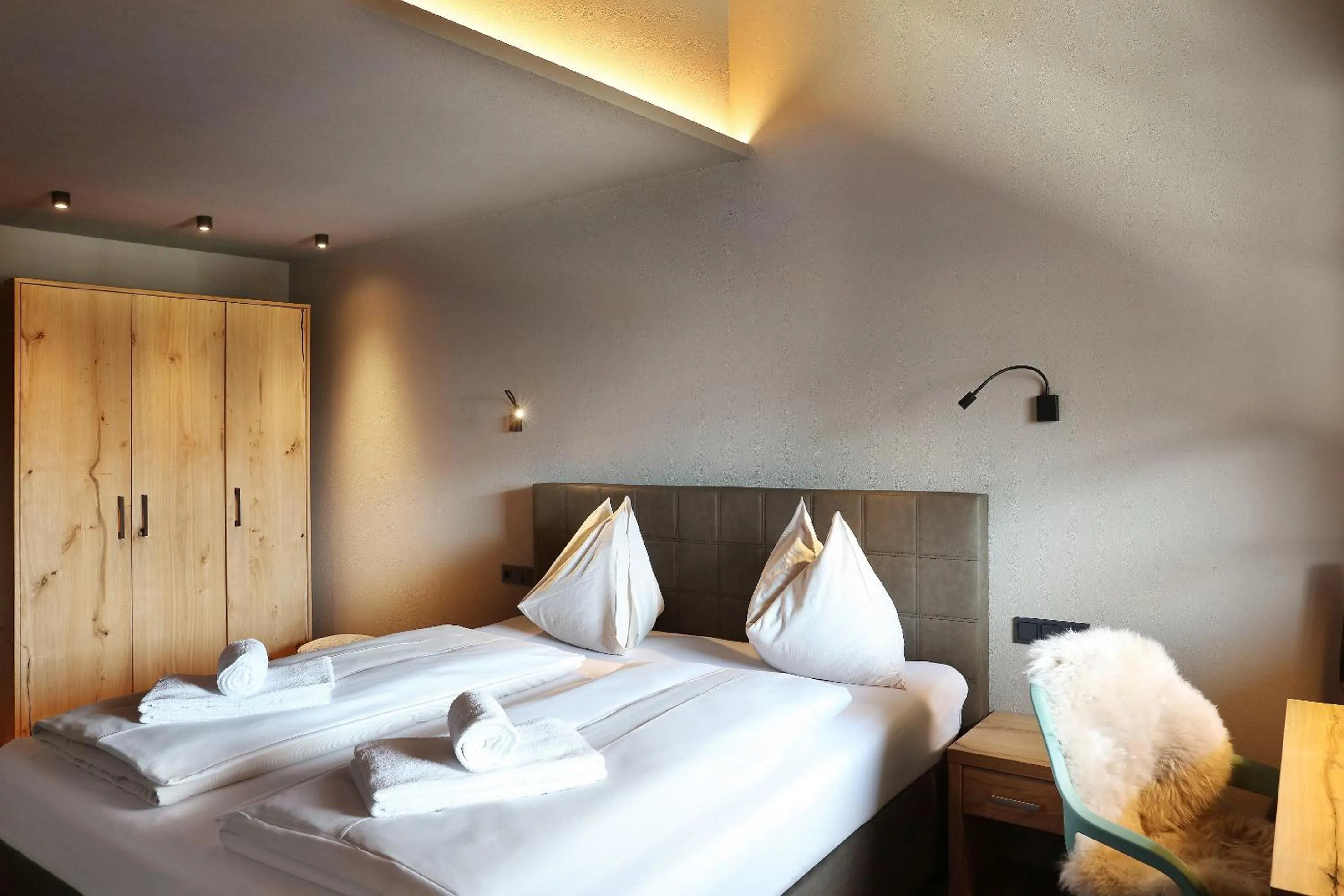 Bed in Tauernsuites Mitterwirt by ALPS RESORTS