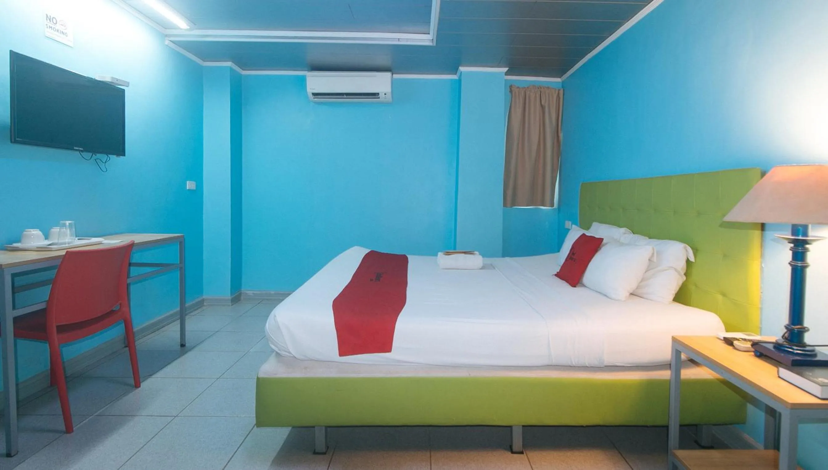 TV and multimedia, Bed in RedDoorz Plus New Era Budget Hotel Mandaue former RedDoorz Plus near UV Mandaue Cebu