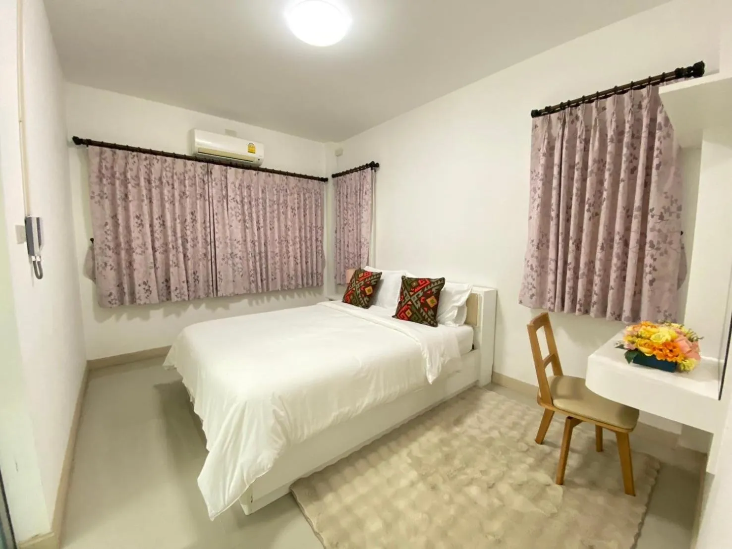 Bed in Baan Pingkan Wellness Resort