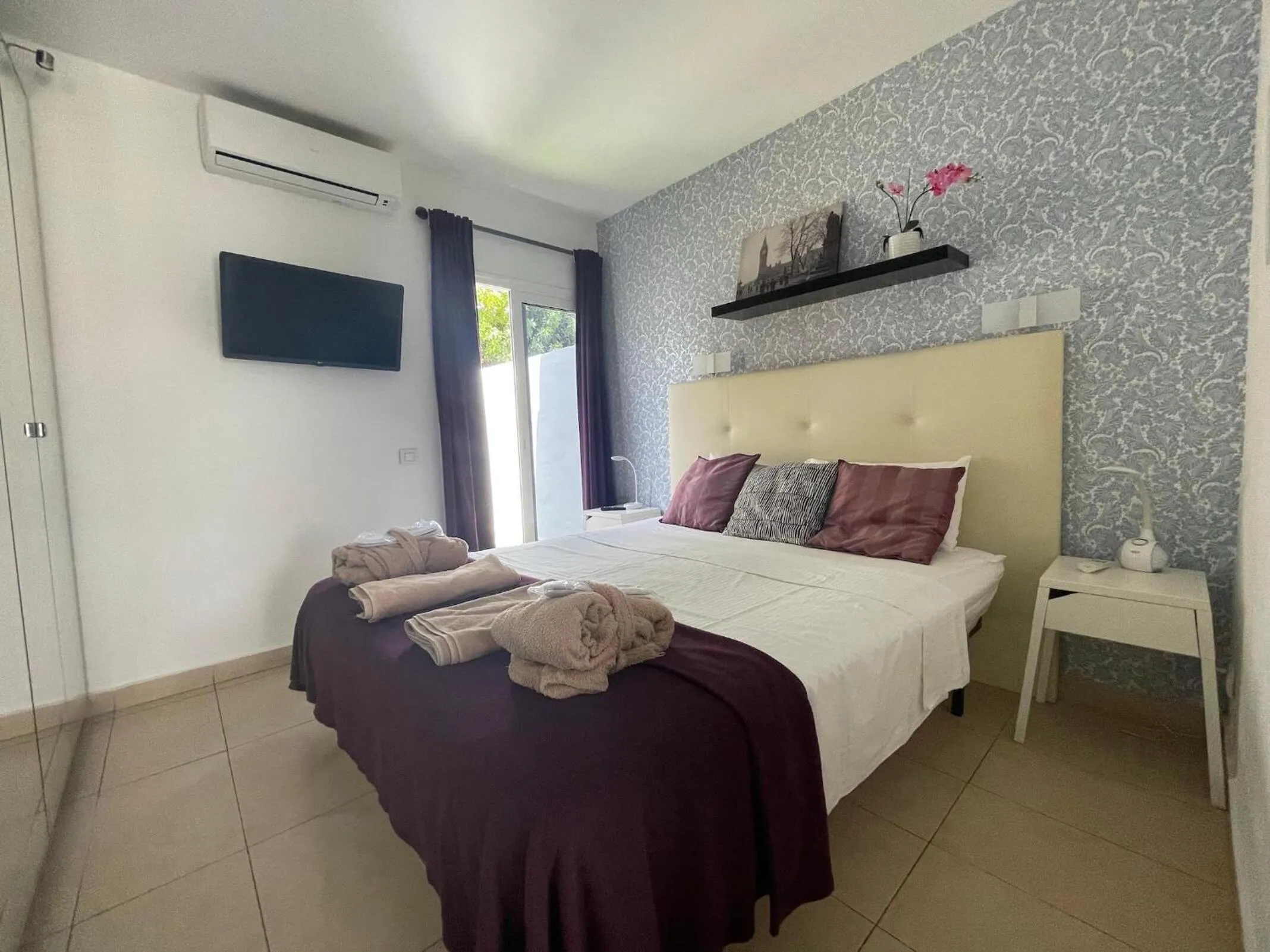 Bed in Rainbow Golf Bungalows, Gay Men-only Resort