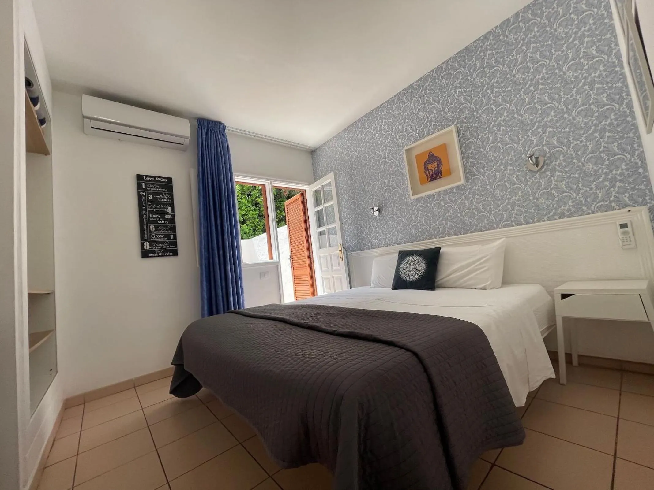 Bed in Rainbow Golf Bungalows, Gay Men-only Resort