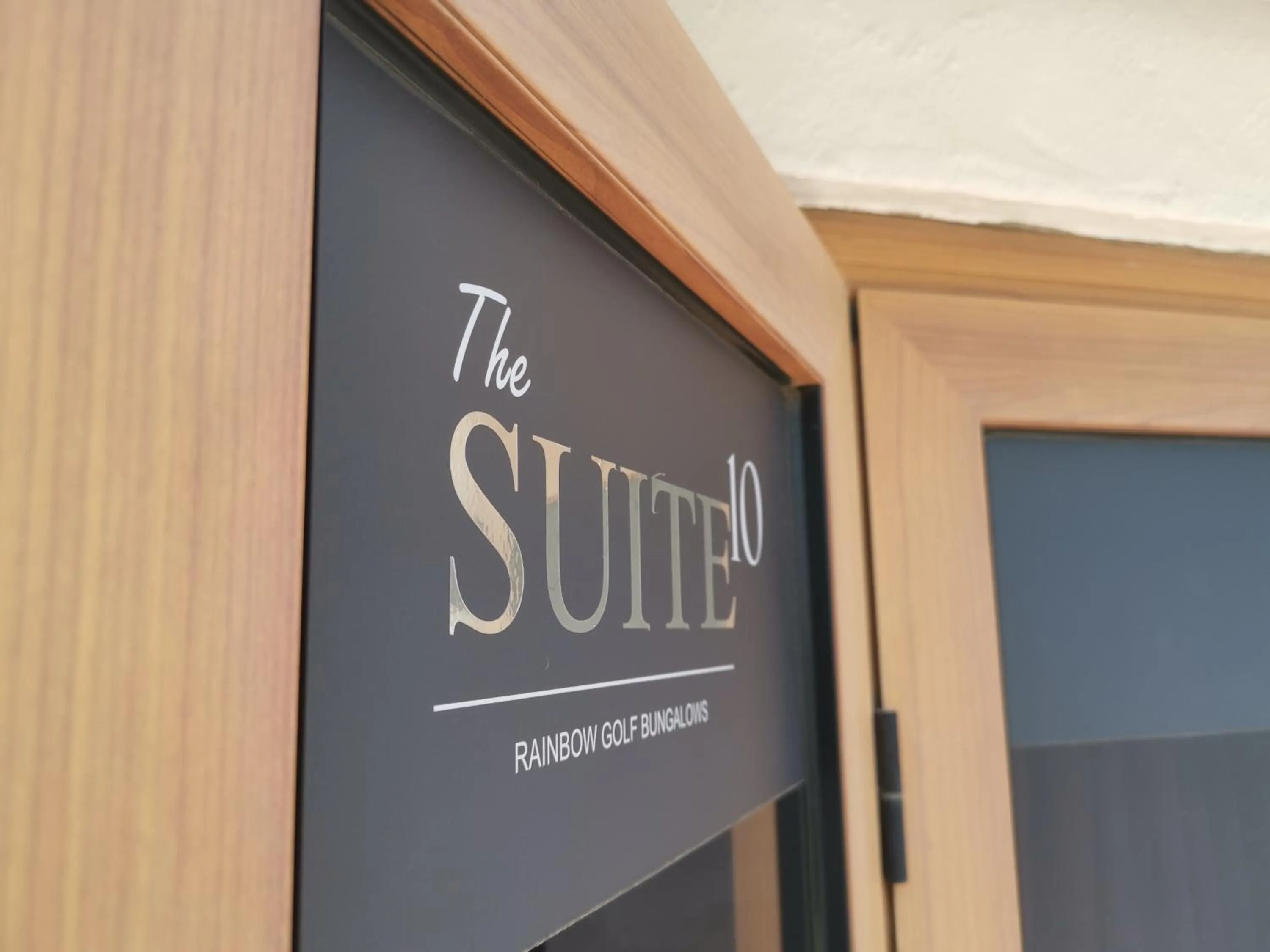 Text overlay in Rainbow Golf Bungalows, Gay Men-only Resort